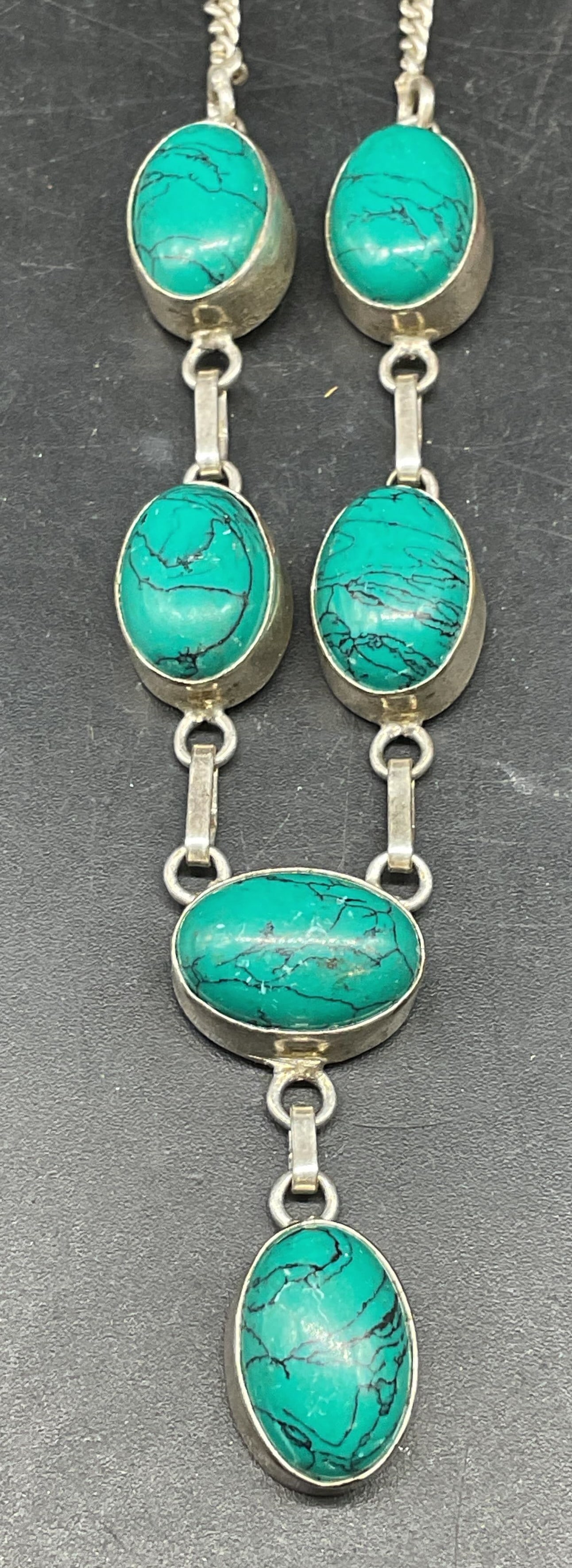 Sterling Silver Blue Semiprecious Necklace: Sterling silver necklace with blue toned semiprecious cabochons. Drop length measures approx. 8 inches. Marked sterling. Total weight 14.9 grams. Some scratching. Jewelry, estate jewelry, fine jewelry