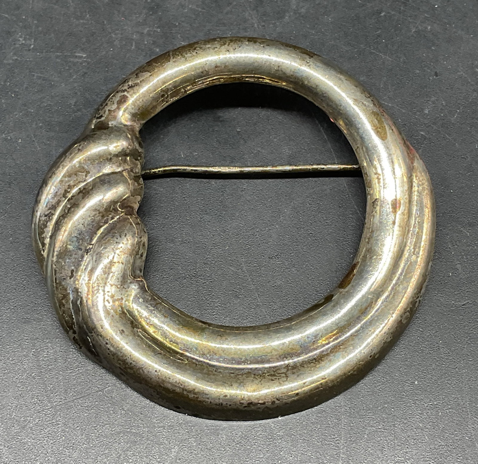 Sterling Silver Open Circle Swirl Brooch: Sterling silver open circle and swirl motif brooch. Marked sterling. Measures approx. 2 inches wide. Total weight 8.4 grams. Some scratching. Jewelry, estate jewelry, fine jewelry, accessories, fashio