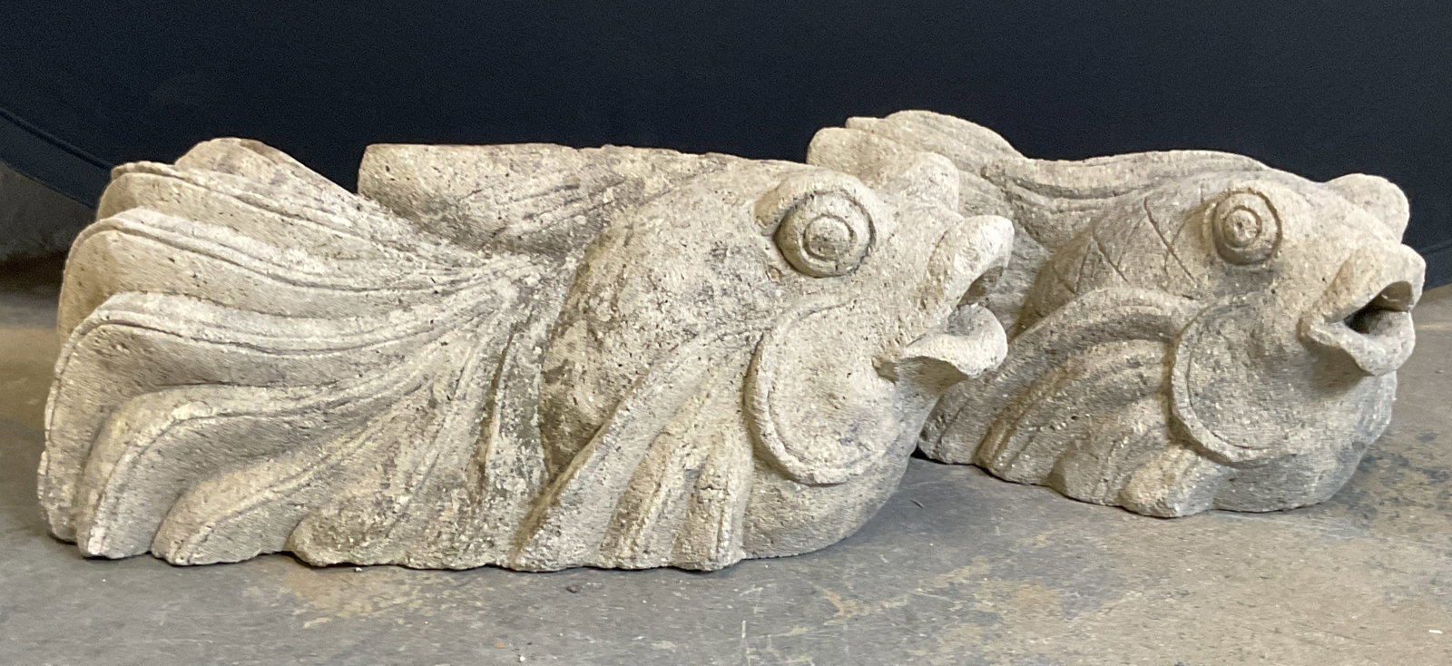 Near Pair Concrete Fish Garden Sculptures: Near pair of vintage carved concrete or stone fish motif garden sculptures. Sizes vary, larger measures approx 15.5 x 5 x 7 inches. Pieces have significant weight. Wear including chipping and losses t