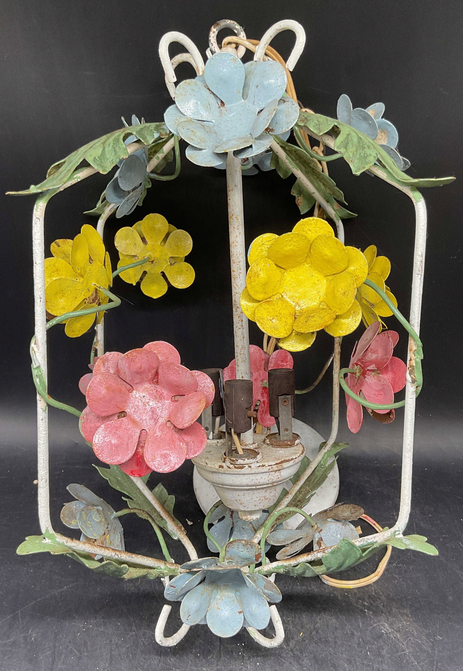 Vtg Iron Flower Chandelier Light Fixture: Vintage iron chandelier light fixture. Painted white and pastel pink, yellow, blue. Wire scroll frame with flowers. Measures approx. 8,5 x 8.5 x 15.5 inches. Not tested. Wear including loss to paint,