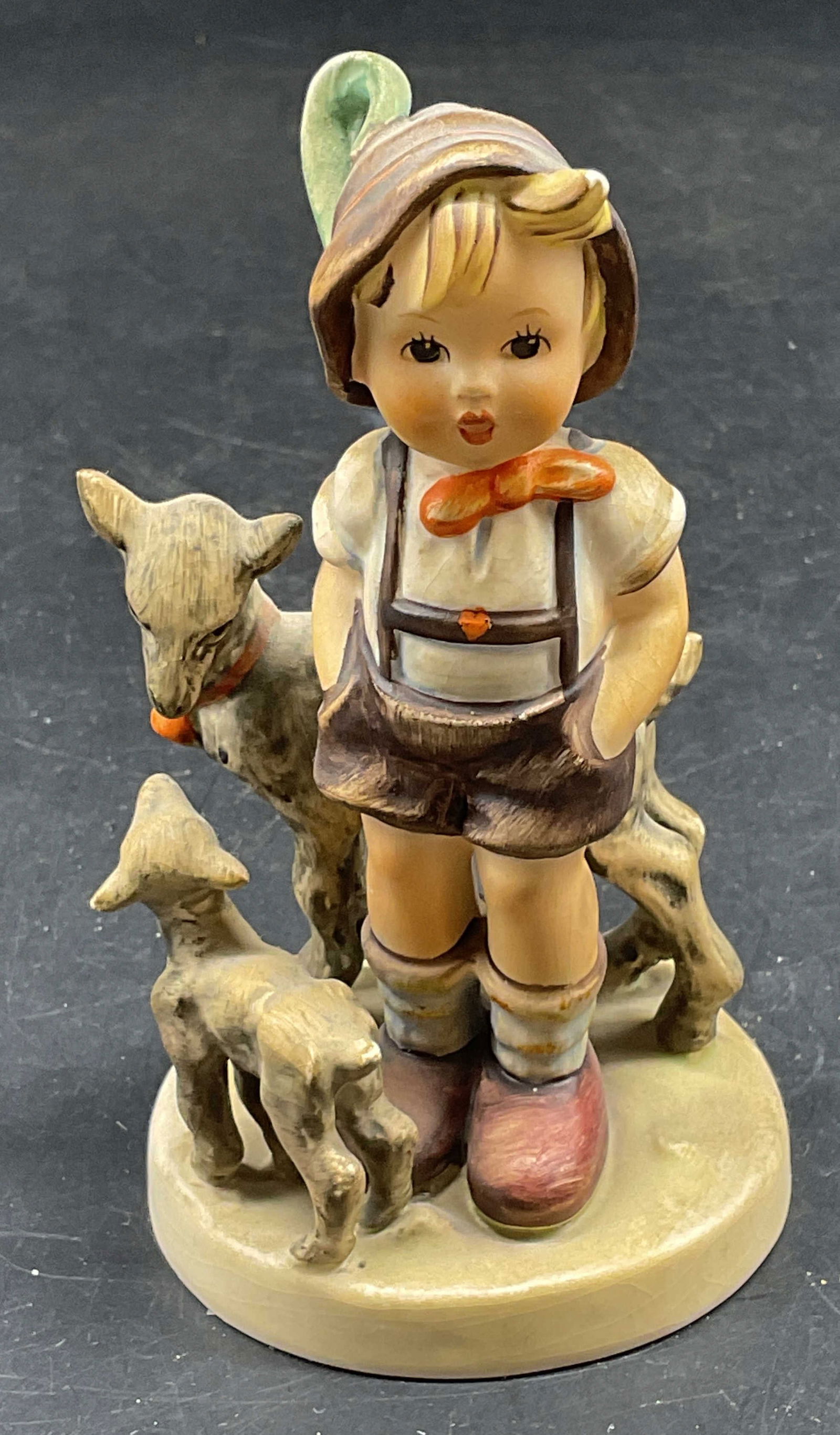 1948 GOEBEL Little Goat Herder Figurine: Circa 1948 GOEBEL Hummel #200 porcelain figurine. Little Goat Herder. Made in Germany. Measures approx. 2.5 x 4.5 inches. Some scratching and crazing. GOEBEL figurine, little goat herder, collectibles