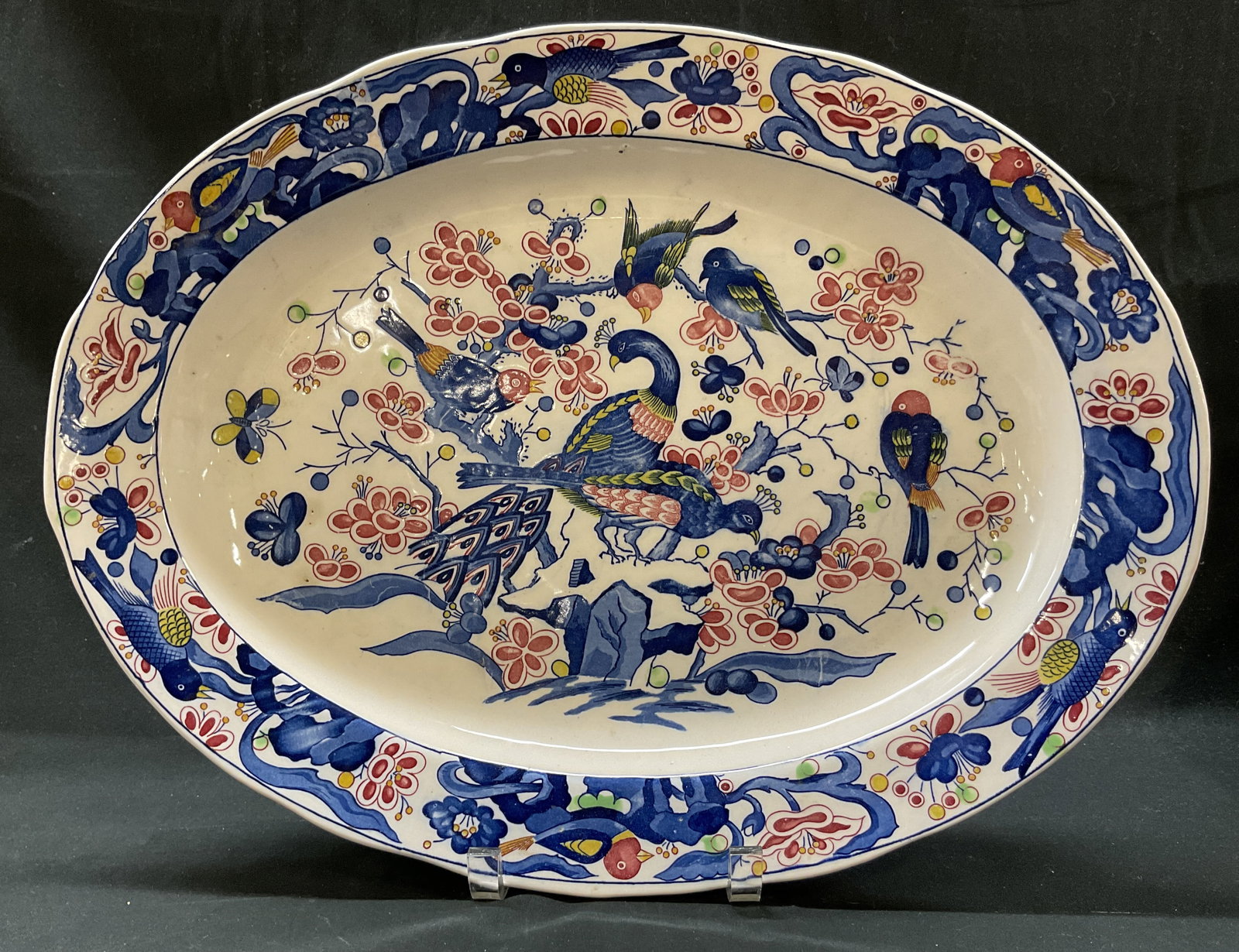 Vtg Japanese Porcelain Peacock Serving Platter: Vintage Japanese porcelain peacock serving platter. Oval shaped platter. Scalloped edge. Hand painted peacock, bird, butterfly, and floral motifs. Blues, reds, yellows, etc. No visible markings. Measu