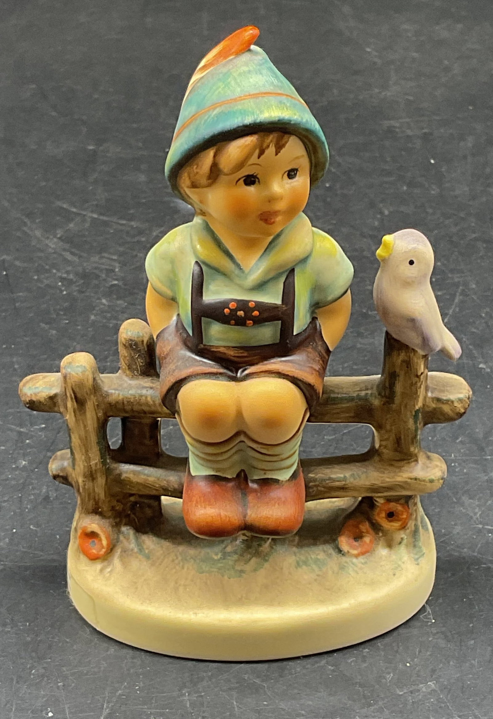 1988 GOEBEL Wayside Harmony Porc Figurine: Circa 1988 GOEBEL Hummel #111 porcelain figurine. Wayside Harmony. Boy on fence. Measures approx. 3 x 4.25 inches. Some scratching and crazing. GOEBEL figurine, wayside harmony, collectibles, home dec