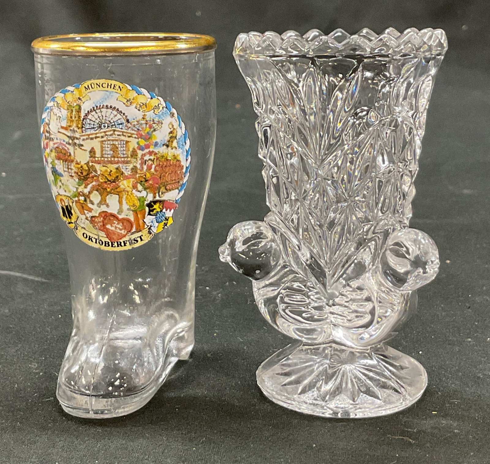 Lot 2 Hofbauer Crystal Byrdes & More Tableware: Lot of 2 items. Hofbauer crystal Byrdes toothpick holder. Sawtooth rim. Cut geometric and fan motifs. Bird motifs. Pedestal base. Lot also includes German souvenir shot glass featuring imagery of Munc