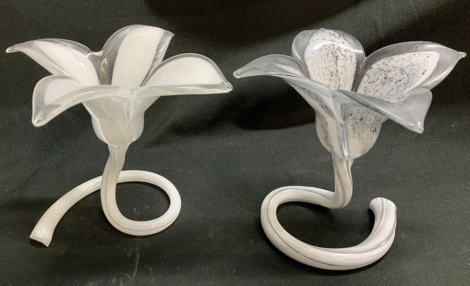 Pair Vtg Hand Blown Art Glass Flower Vases: Lot includes, a pair of vintage hand blown art glass vases shaped like a flowers with a curled base. White & grey toned. No visible signature or markings. Surface wear consistent to age, use & exposur