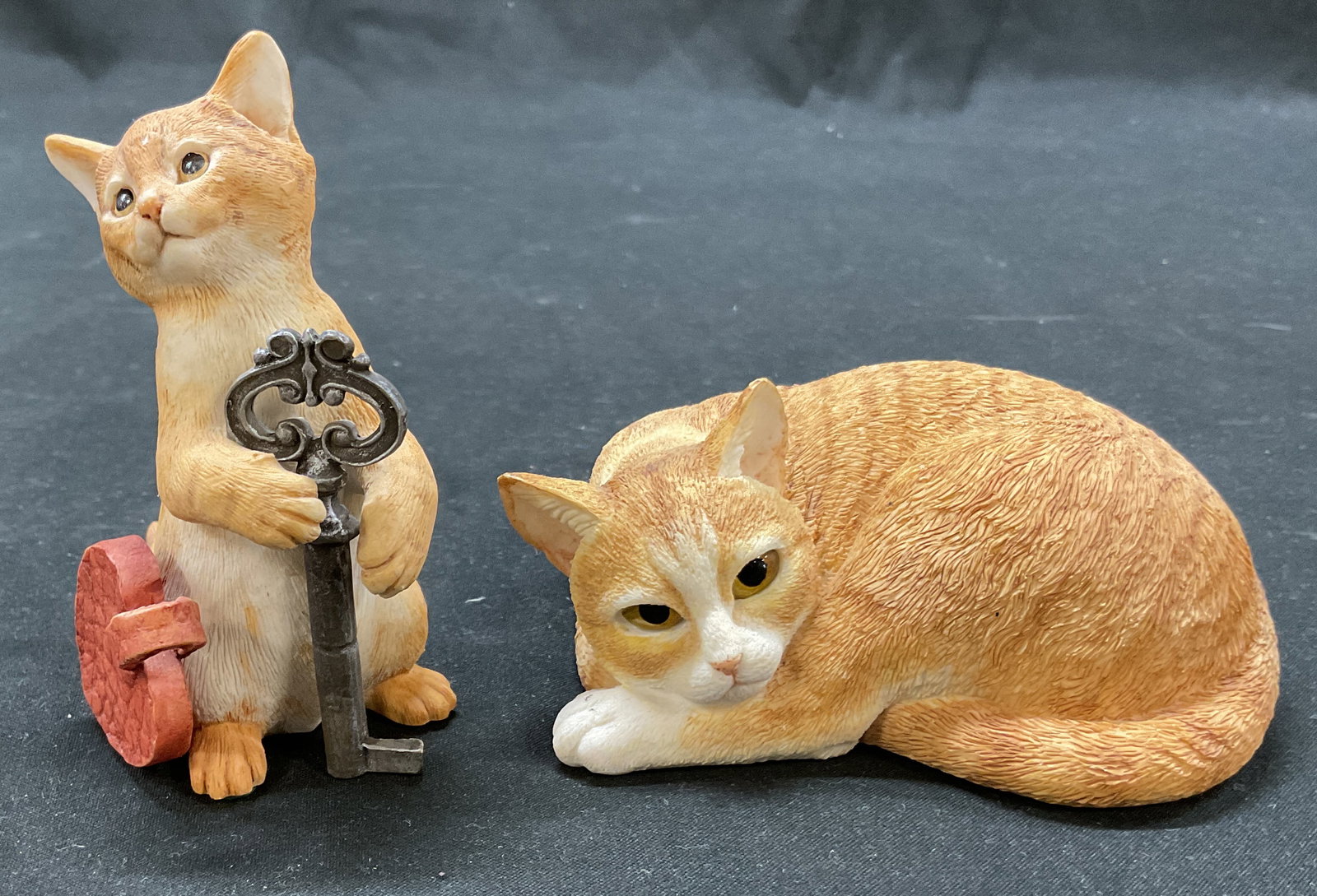 Lot 2 Country Artists Cat Figures: Lot of 2 Country Artists resin cat figures. Marked Country Artists on underside. Lot includes Ginger Tabby Cosy and Looking For Love Cat. Detailed features and textures. Looking For Love Cat has heart