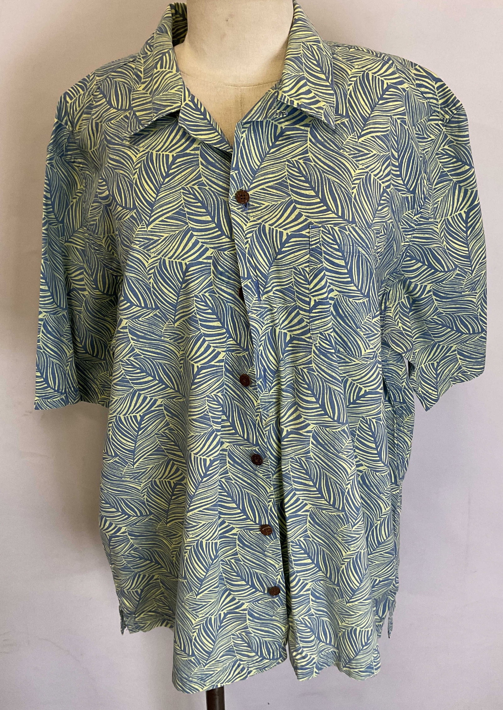 L.L. Bean Blue Floral Button Up: L.L. Bean blue floral button up. Size L. Cotton material. Short sleeve with buttons along the front. Collared. Blue and green floral leaf pattern. Front pocket. Wear consistent with exposure. L.L. Bea