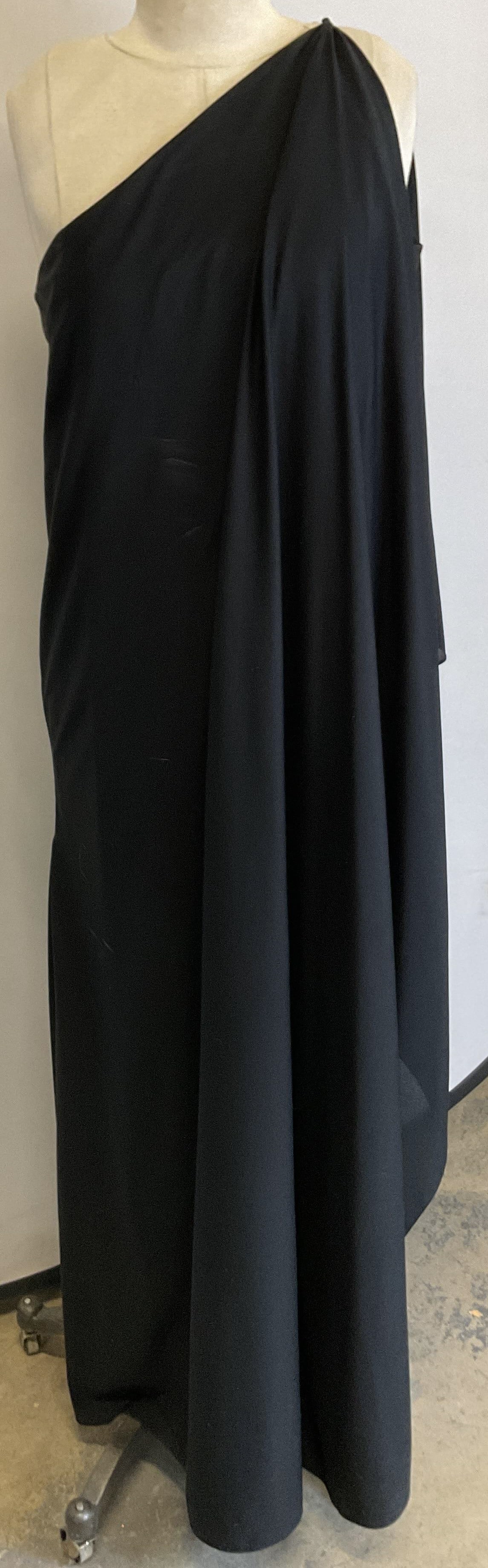 Off Broadway International Off Shoulder Dress: Off Broadway International black off the shoulder dress. Cotton material. Long off the shoulder dress. Ruffled design accent. Split seam. Measures approx 15 inches across chest. Measures approx 55 inc
