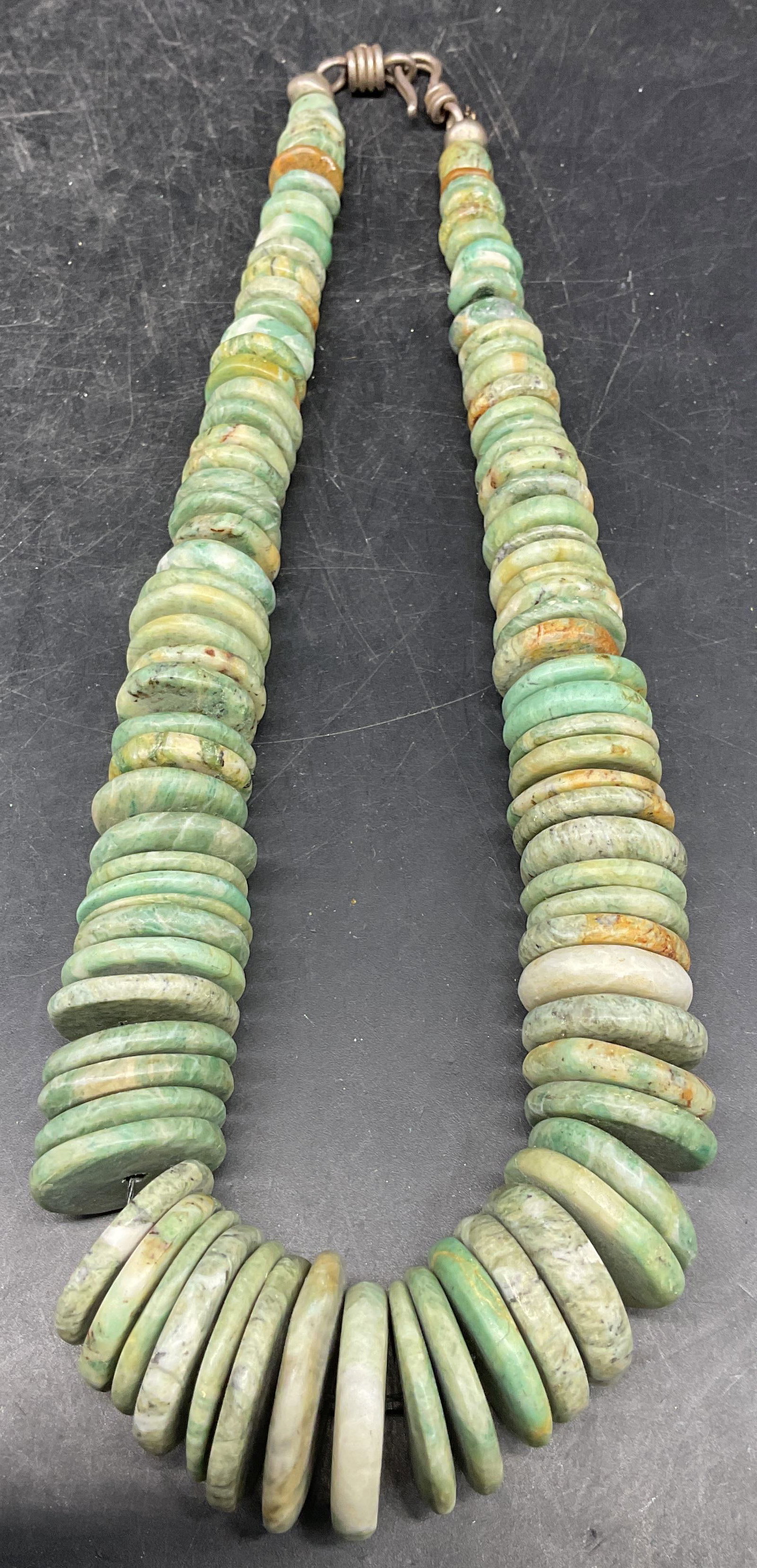 Vintage Green Stone Disc Beaded Necklace: Vintage green stone disc beaded necklace. Drop length measures approx. 7.75 inches. Necklace has weight. Some scratching. Jewelry, estate jewelry, fine jewelry, cocktail jewelry, fashion jewelry, acce