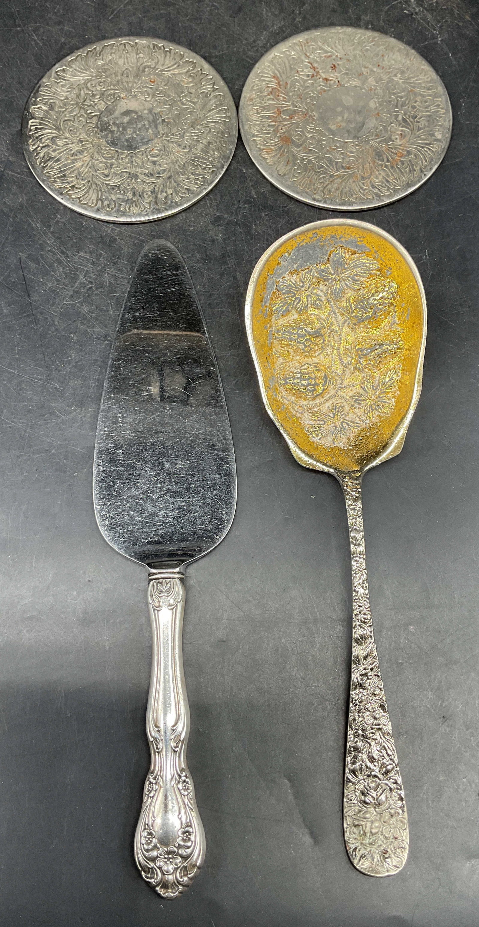 Lot 4 GODINGER Berry Spoon, Alvin Server +: Lot of 4 pieces. Vintage signed GODINGER silver and gold tone ornate berry serving spoon. Measures approx. 9 inches long. Loss to finish and scratching. Vintage signed Alvin silver plated handle cake