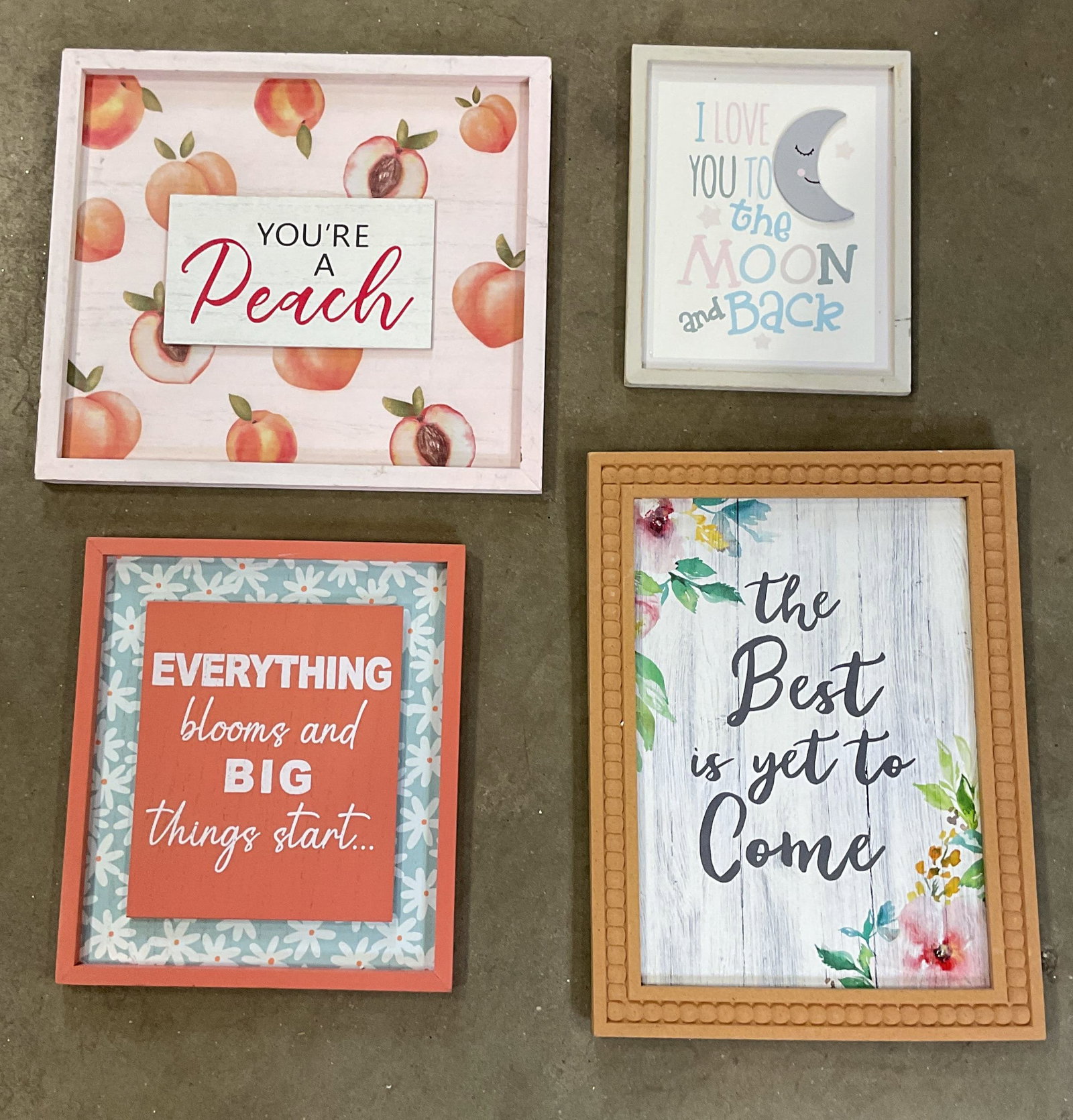 Lot 4 Framed Wood Home Wall Signs: Lot of 4 framed wood home wall signs. Everything Blooms, Youre a Peach, Love You, and Best Yet To Come motifs. Largest measures approx. 14.25 x 12.75 inches. Wear including marks and scratching. Art,
