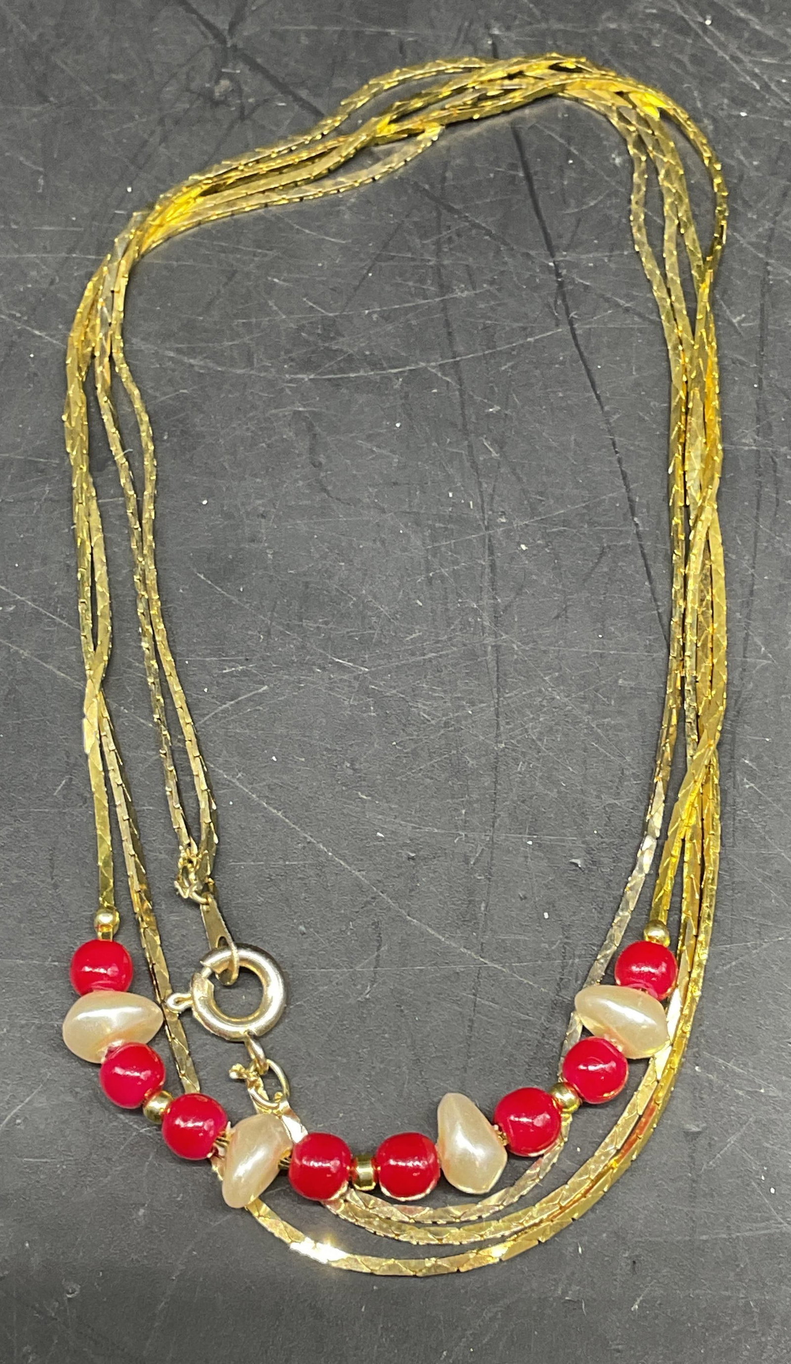 Vintage Gold Tone Faux Pearl Necklace: Vintage double stand faux pearl and red beaded necklace. Drop length measures approx. 8 inches. Some scratching. Jewelry, estate jewelry, costume jewelry, cocktail jewelry, fashion jewelry, accessorie