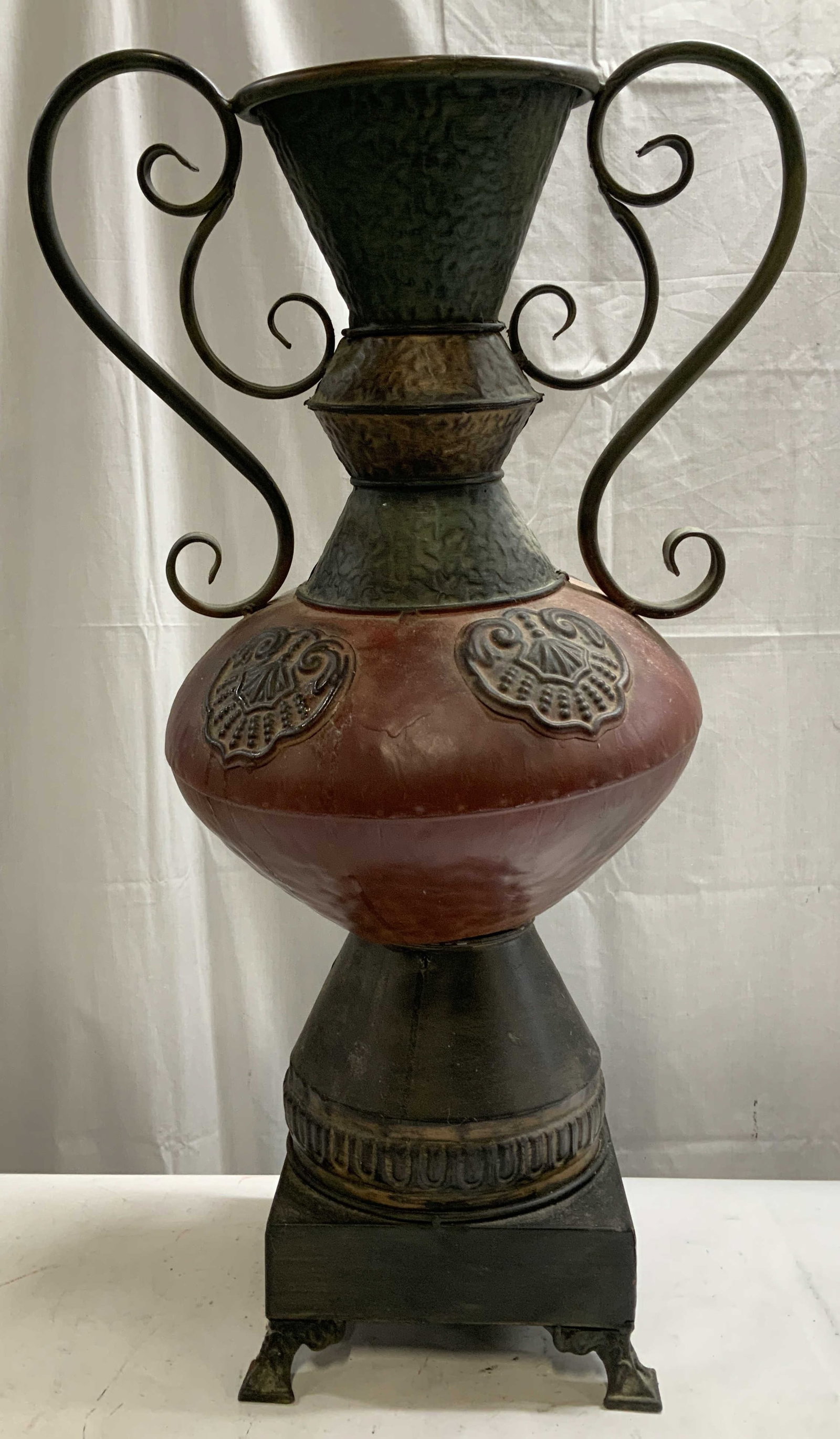 Vtg Large Amphora Ornate Metal Vessel 28in: Vintage amphora style vessel features scroll handles & a square base. Ornate detailing. Metal material. No visible signature or markings. Surface wear consistent to age, use & exposure. Needs