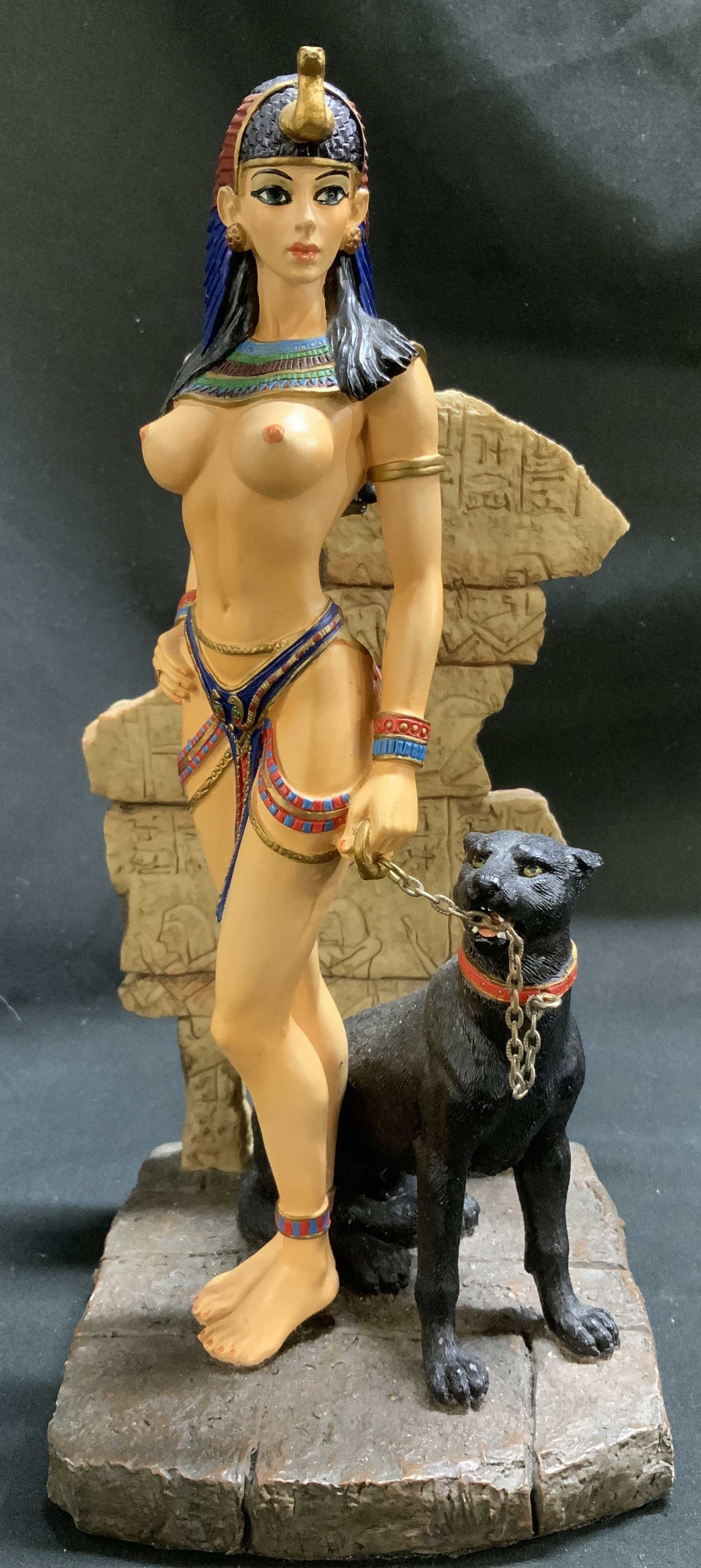 Veronese Egyptian Goddess W Panther Figurine: Figurine depicts an Egyptian woman with a headdress & black panther. Stands on rocky like base. Resin/composite material. Signed & marked on underside. Reads, VERONESE. Surface wear consistent to age,