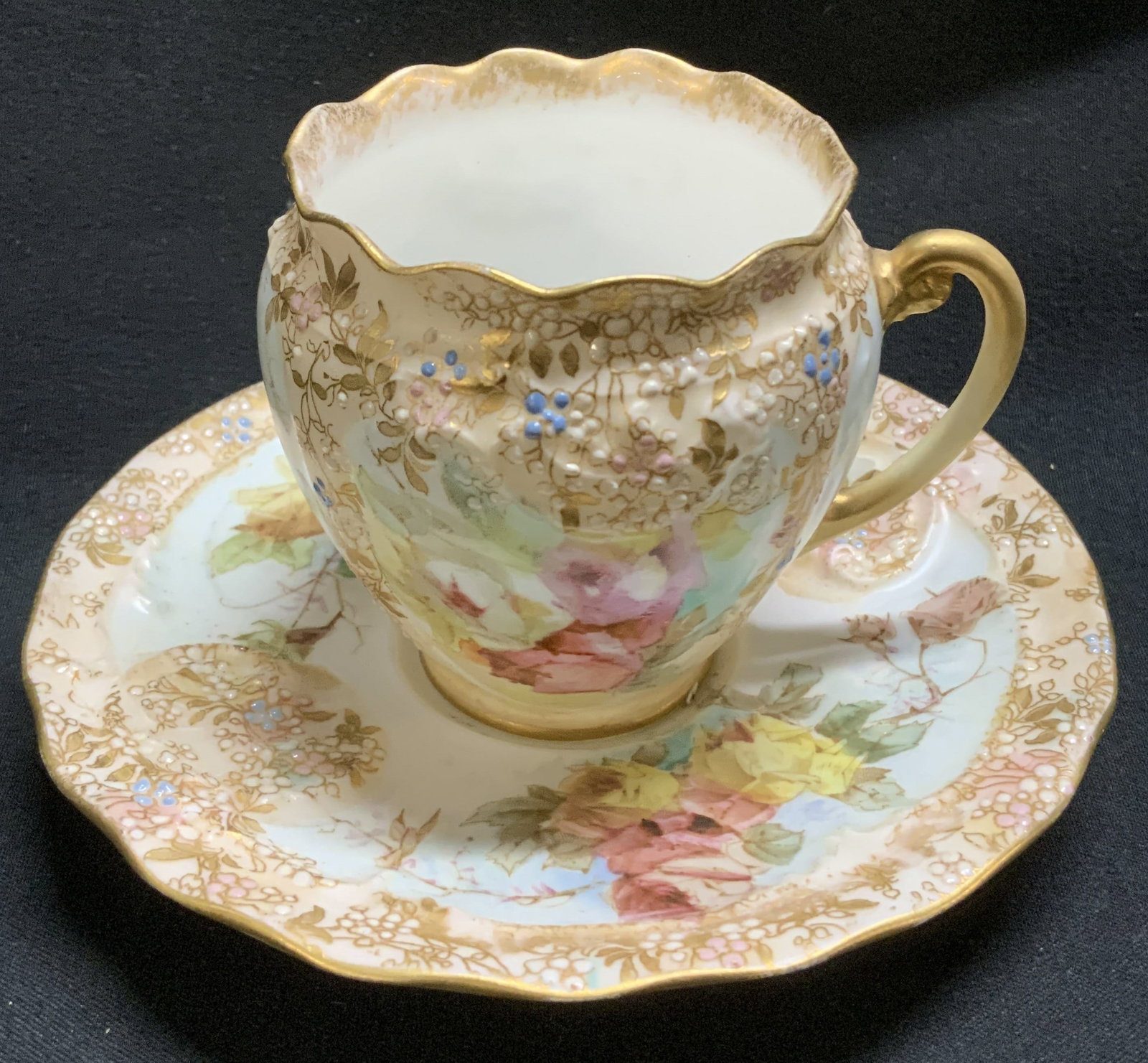 Vtg Doulton Floral Teacup & Saucer ENGLAND: Lot includes, vintage Doulton teacup & saucer featuring floral motifs. Scalloped rim & hand painted details. Gilt accents. Ceramic material. Signed & marked on underside. Reads, DOULTON BURSLEM ENGLAN