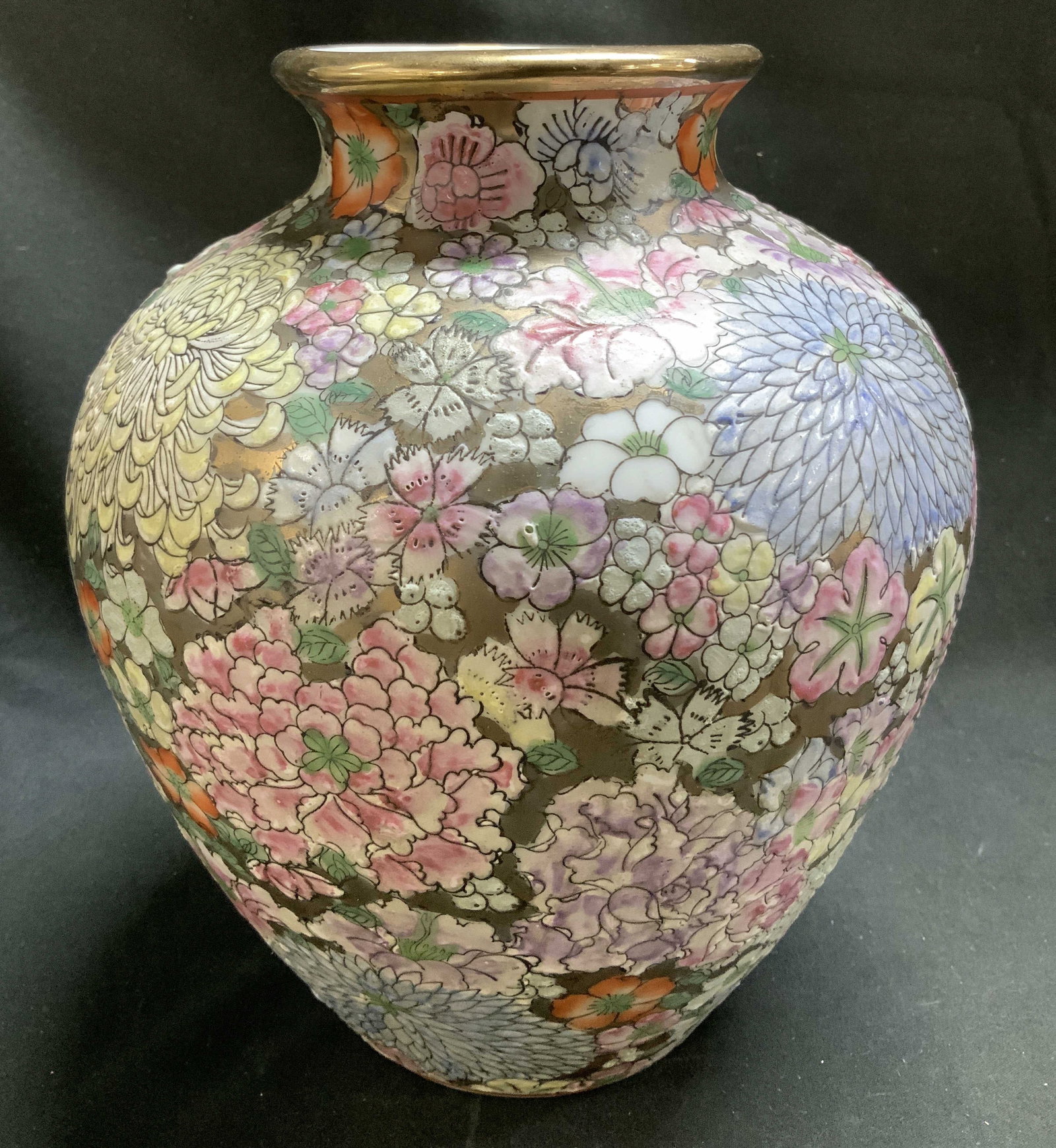 Sgnd Hand Painted Gilt Floral Porcelain Vase: Porcelain vase features hand painted vibrant floral motifs & gilt background. Round shape. Signed & marked on underside. Visible mark. Surface wear consistent to age, use & exposure. Measurements: len