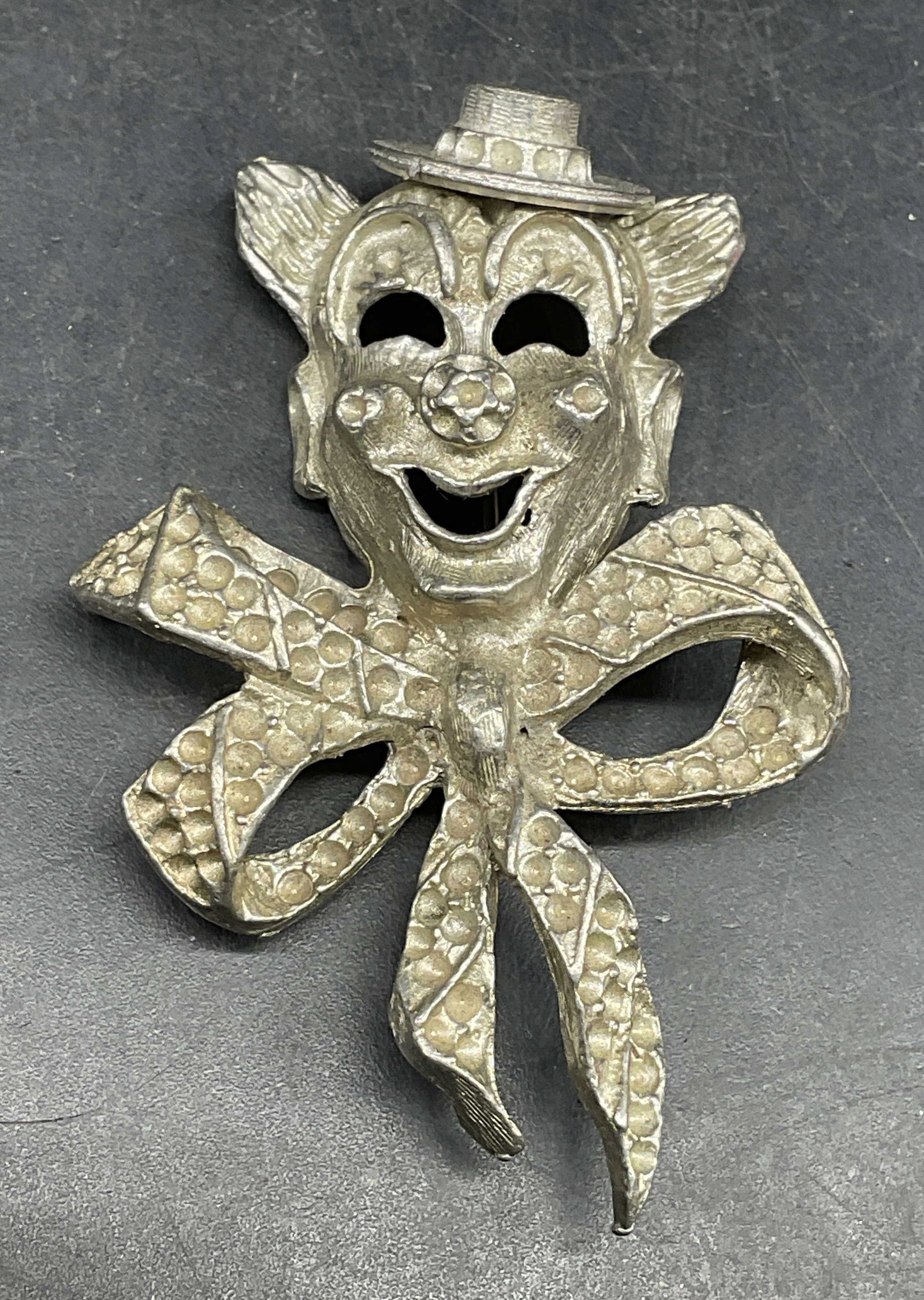 Vintage Silver Tone Clown Bow Brooch: Vintage silver tone clown and bow motif brooch. Measures approx. 2.25 x 1.5 inches. Some scratching. Jewelry, estate jewelry, costume jewelry, fashion jewelry, cocktail jewelry, accessories, fashion a