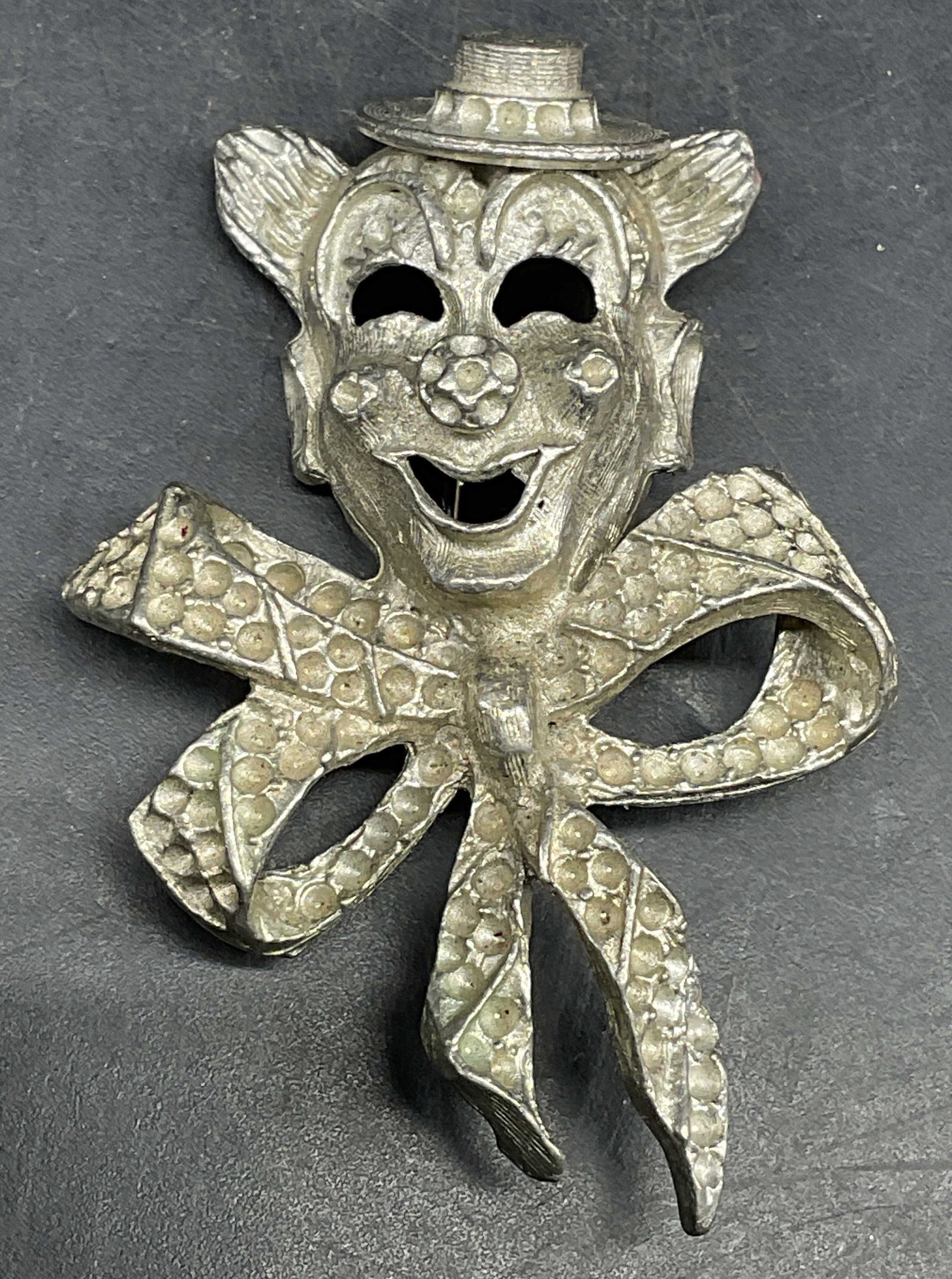 Vintage Silver Tone Clown Bow Brooch: Vintage silver tone clown and bow motif brooch. Measures approx. 2.25 x 1.5 inches. Some scratching. Jewelry, estate jewelry, costume jewelry, fashion jewelry, cocktail jewelry, accessories, fashion a