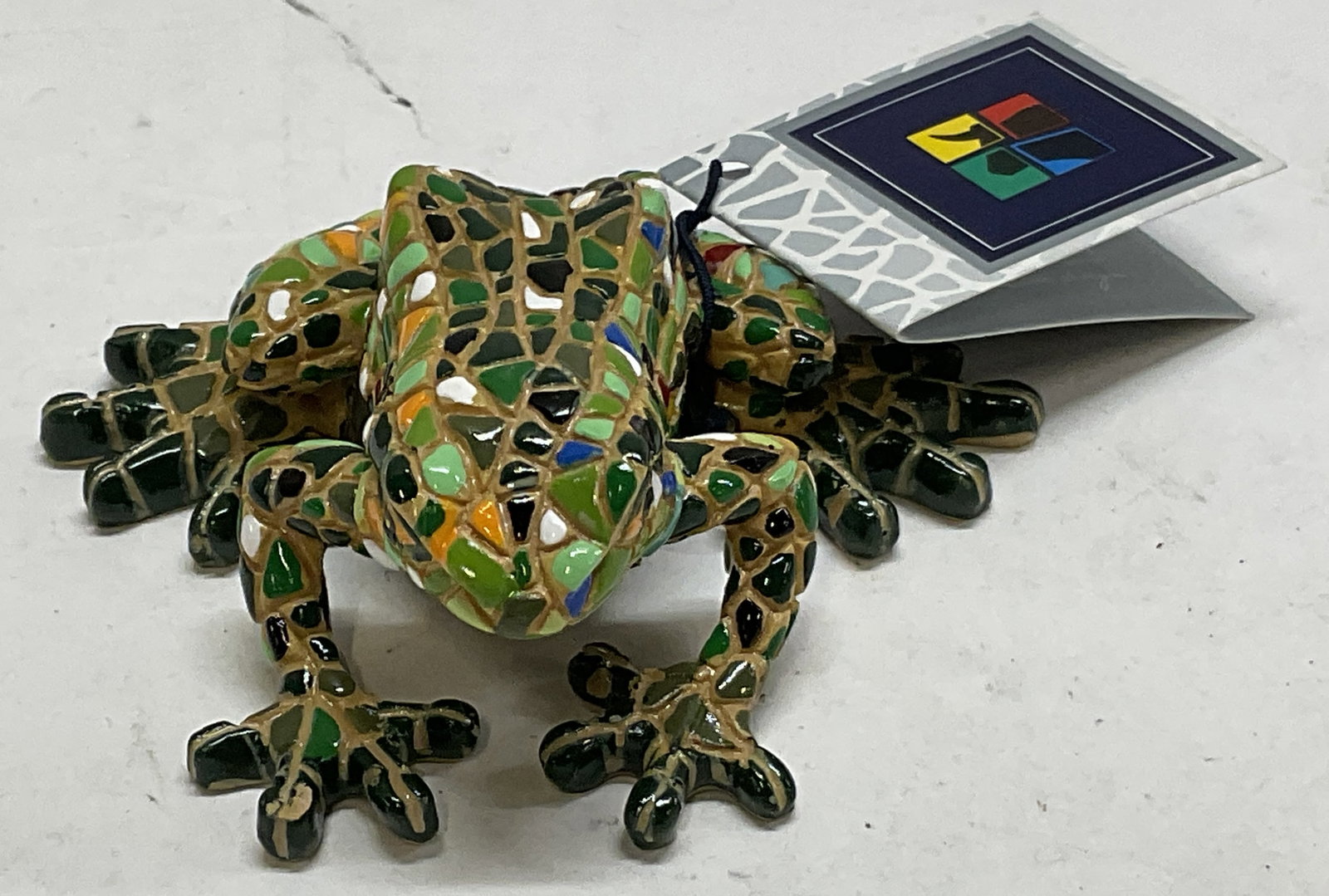 Barcino Innovative Design Mosaic Frog Fig SPAIN: Barcino Innovative Design Mosaic Frog Figurine. Spain. Made of Resin and Hand-Painted in Colorful Mosaic Style. Comes with Box. Condition Consistent with Exposure. Measures app 1.25in H x 3in L.
