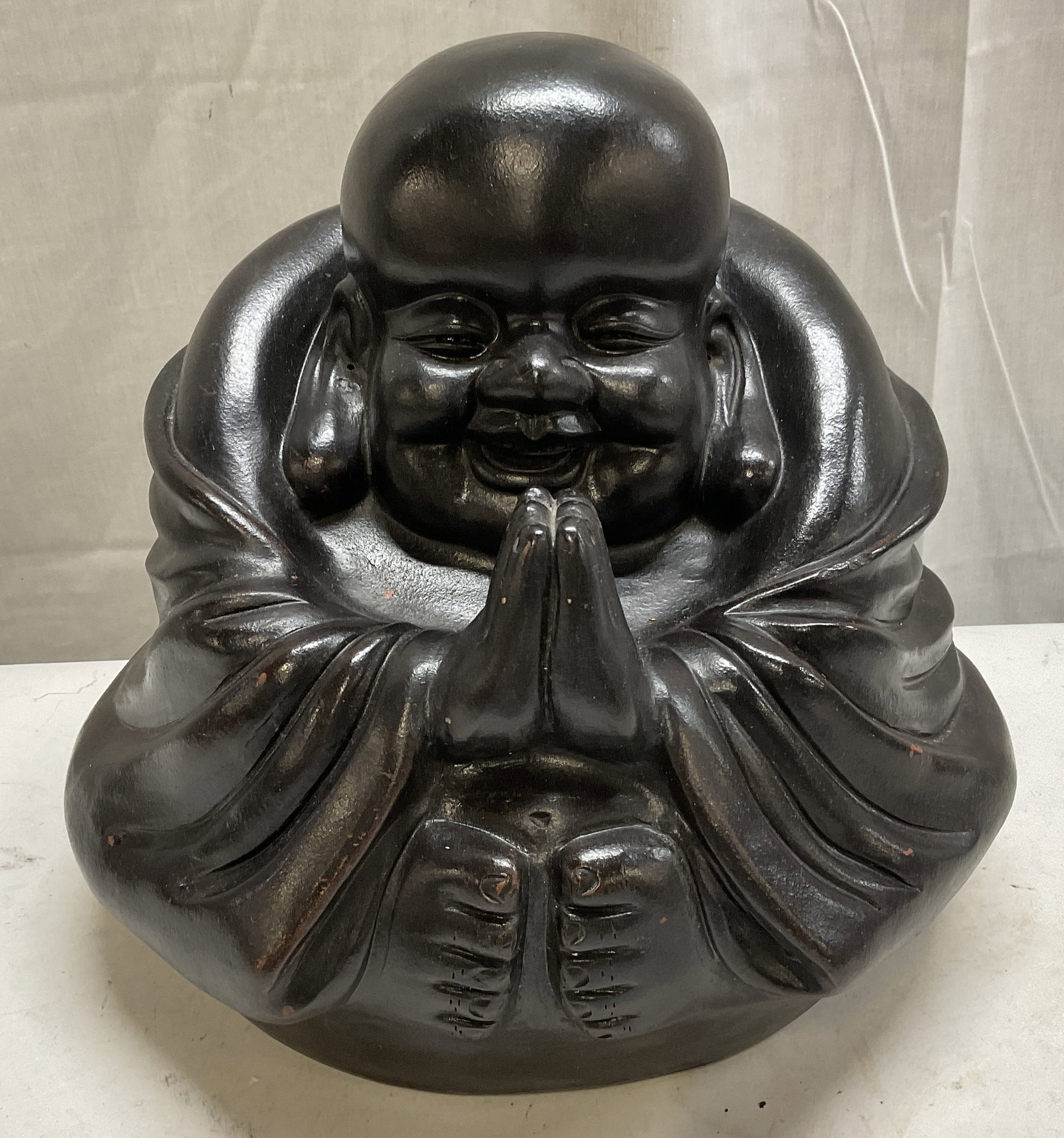 VTG SIGNED Ceramic Laughing Buddha Statue: Vintage Signed Ceramic Laughing Buddha Statue. Signed with Asian Characters. Matte Black Finish. Has Significant Weight. Some Paint Chips Consistent with Exposure. Measures app 11in H x 12in W.