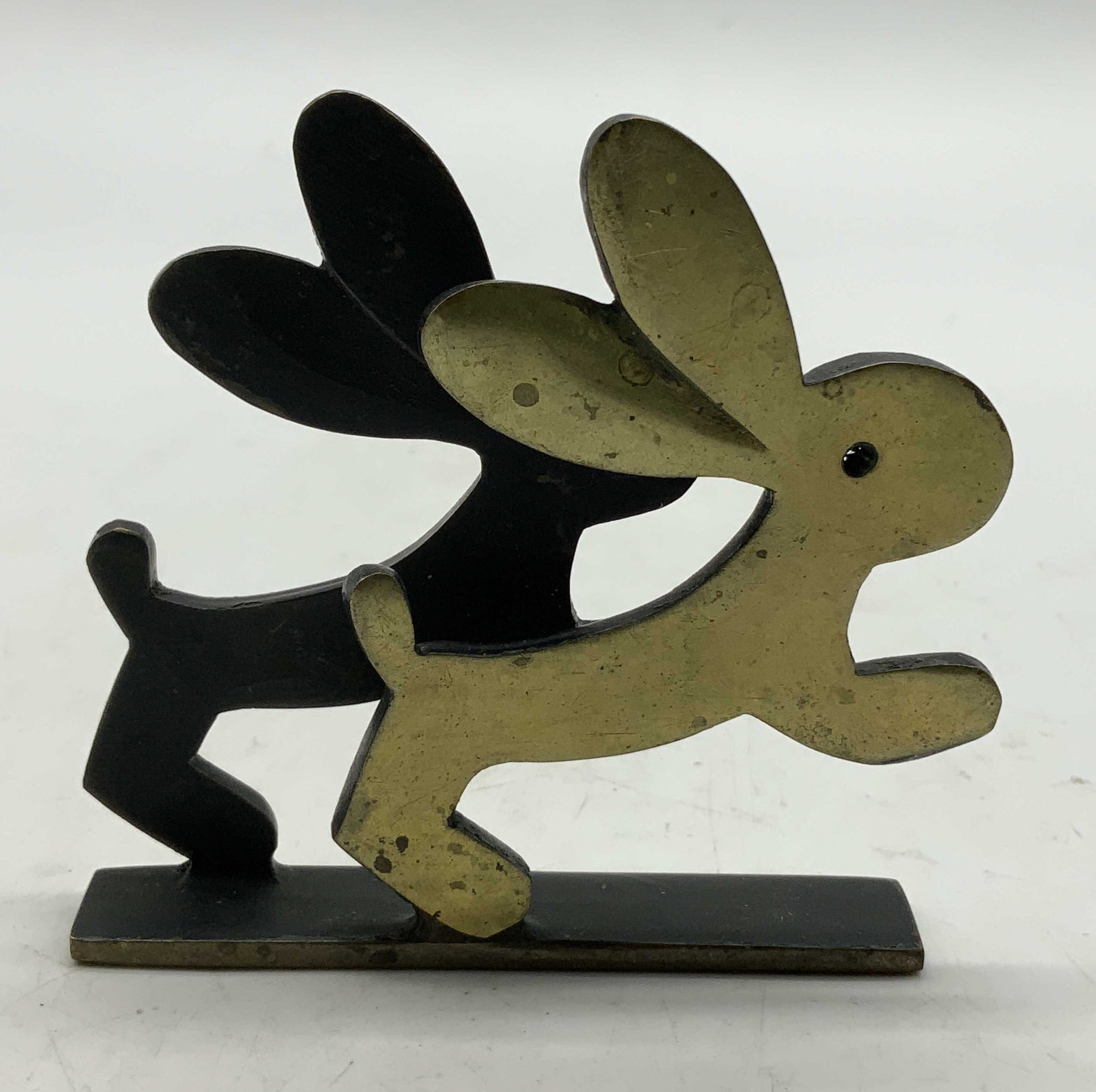 Vtg Walter Bosse Brass Rabbit Figurine: Vintage Walter Bosse brass figurine depicting 2 running rabbits. Interior & base is black toned. Surface wear consistent to age, use & exposure. No visible signature or markings. Measurements: length 