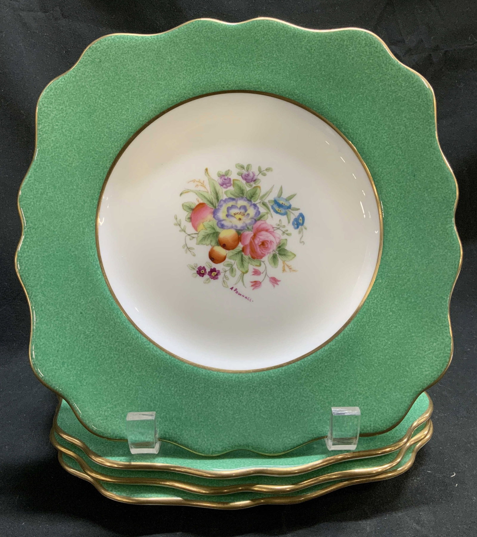 Set 4 Wedgwood Floral Porcelain Plates ENGLAND: Set 4 of Wedgwood porcelain plates featuring central floral motifs. Scalloped rim. Gilt accents. Signed & marked on underside. Reads, WEDGWOOD MADE IN ENGLAND. Surface wear consistent to age, use & ex