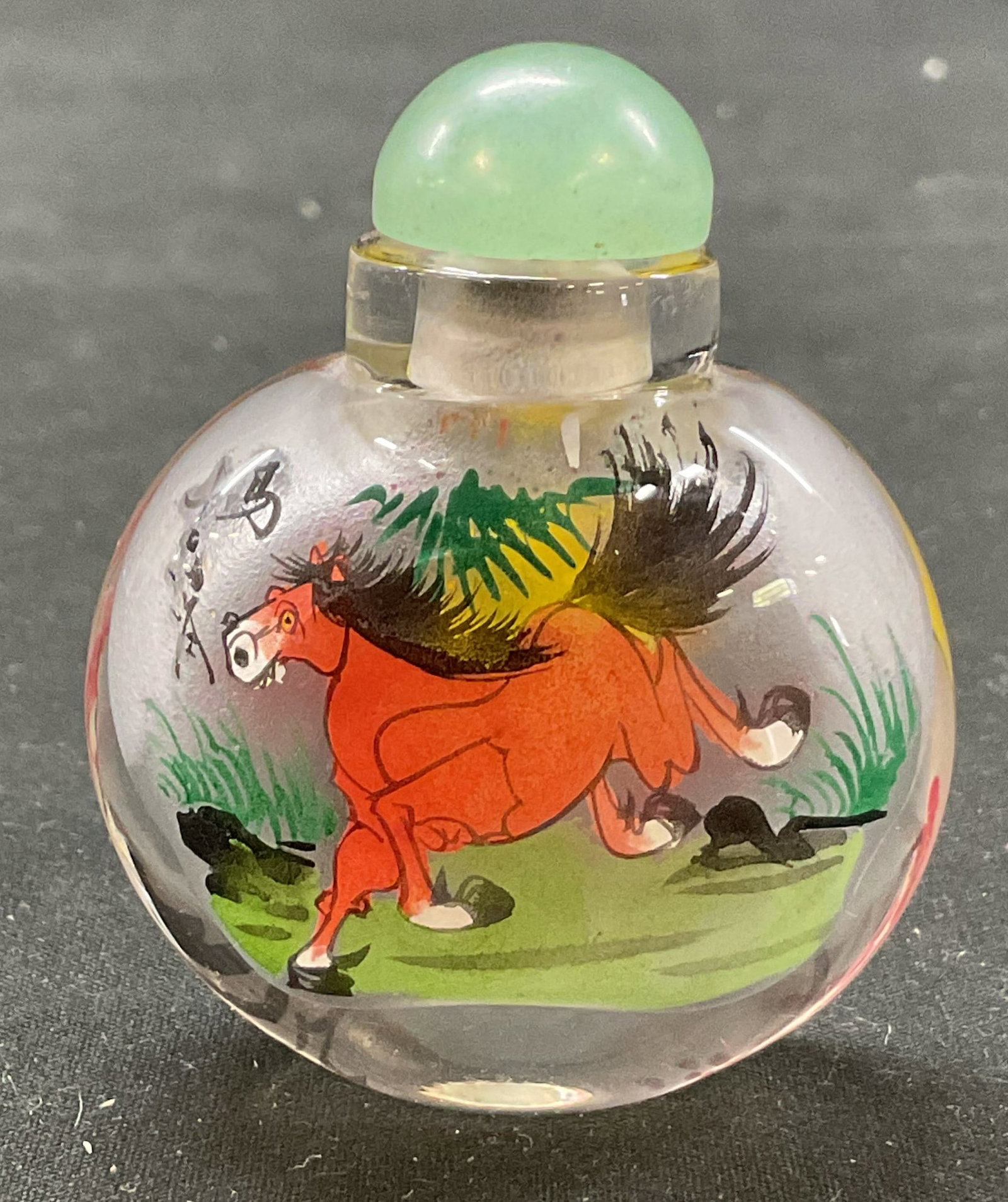 Vtg Oriental Style Glass Snuff Bottle W Stopper: Vintage Oriental style glass snuff bottle. Comes with green stopper. Round bottle. Hand painted horse, bird, and floral motifs in varying colors. Appears to have characters. Measures approx 2 x 2.5 in