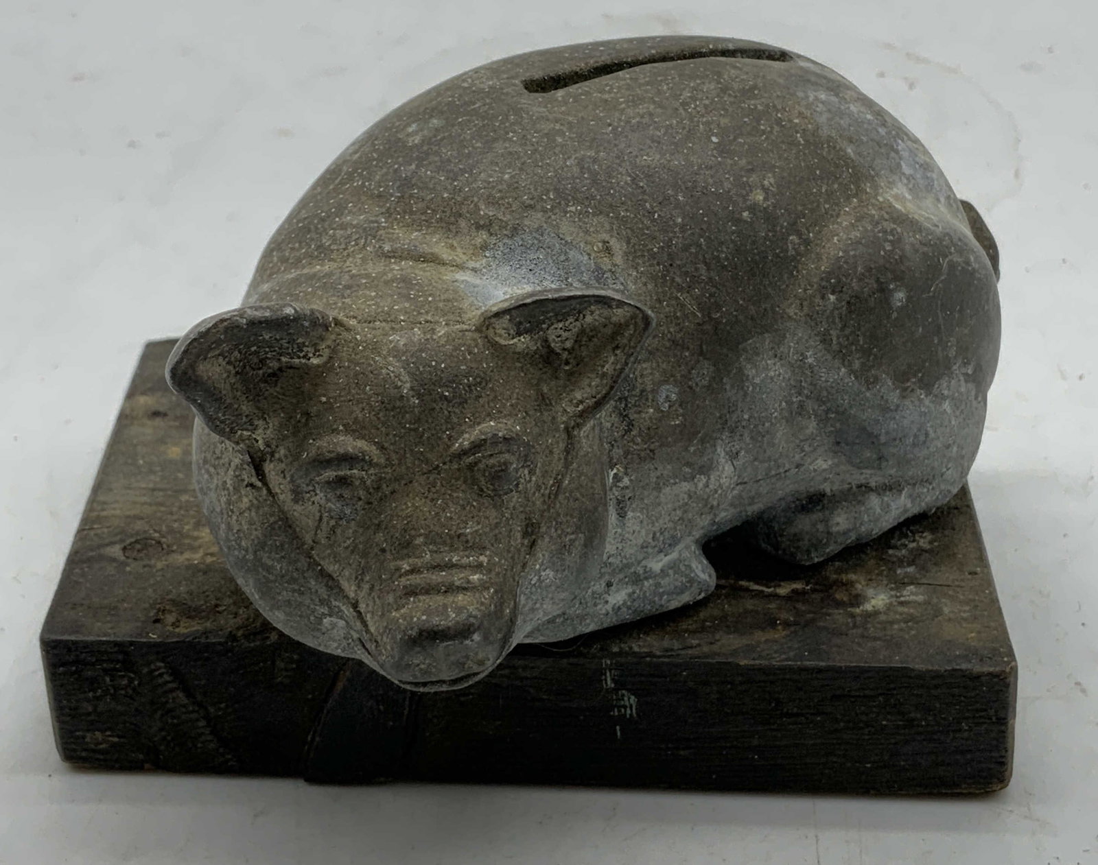 Vtg Wood & Metal Pig Coin Bank: Vintage metal coin bank shaped as laying pig. Sits on a rectangular wooden base. Surface wear consistent to age, use & exposure. No visible signature or markings. Measurements: length 3.8in x width 2.