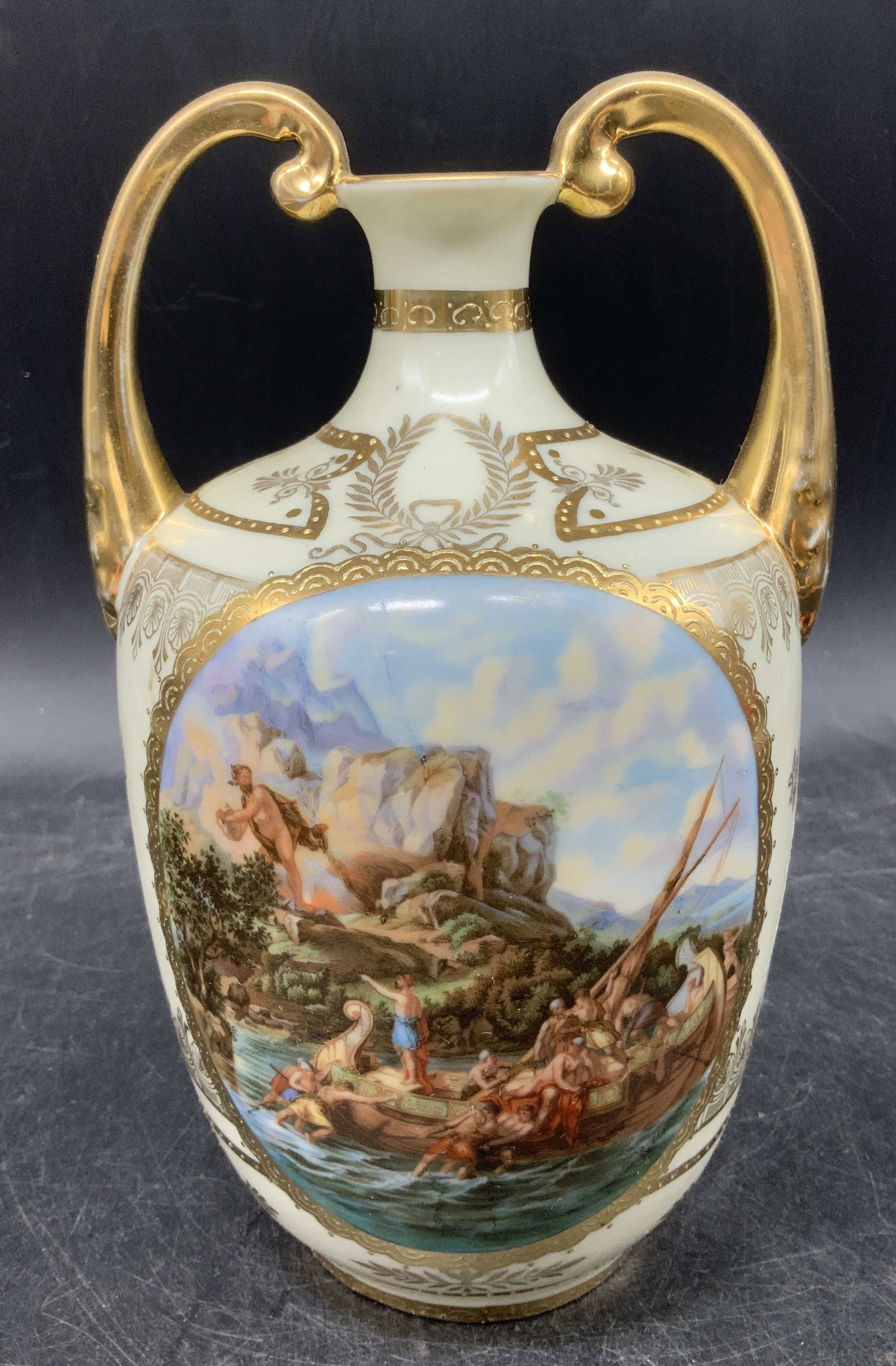 Vtg Odyessus of Cyclops Porcelain Vase AUSTRIA: Vintage Austrian porcelain vase featuring hand painted gilt accents on body. Detailed scene in center. High arched scrolled handles. Signed & marked on underside. Reads, OF ODYSSEUS FROM COUNTRY OF CY