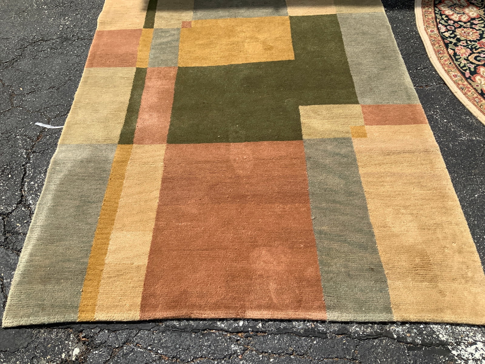 Vtg Multi Color Geometric Rug: Vintage geometric rug in a multi-color design. Green, yellow, coral. Synthetic material. Surface wear consistent to age, use & exposure. Measurements: length 96.5in x width 61in. Vintage multi color g