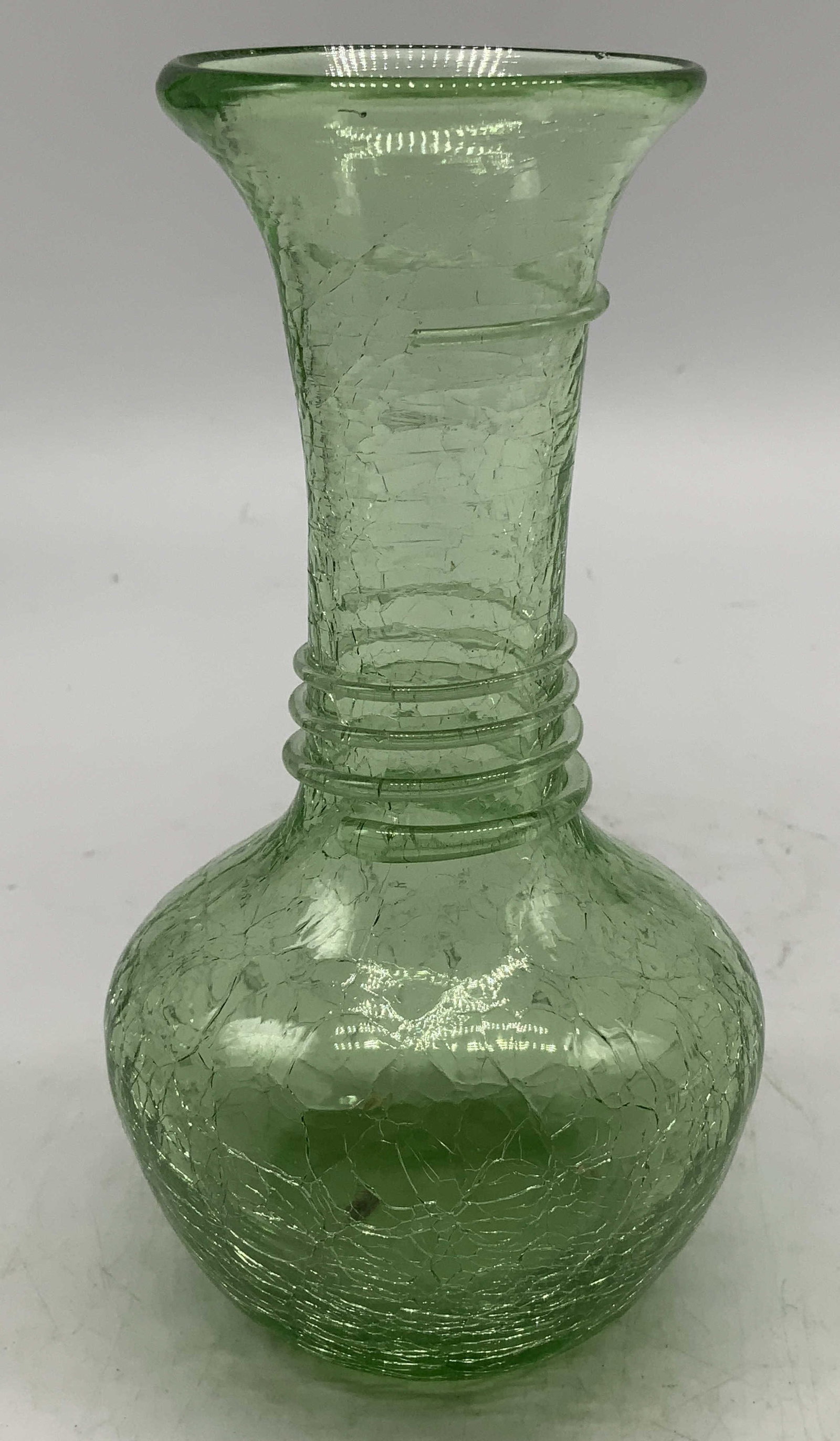 MCM Green Crackle Glass Vase: Mid Century Modern glass vase featuring a distinctive crackle finish. Bulbous shape & long neck. No visible signature or markings. Surface wear consistent to age, use & exposure. Measurements: Length 