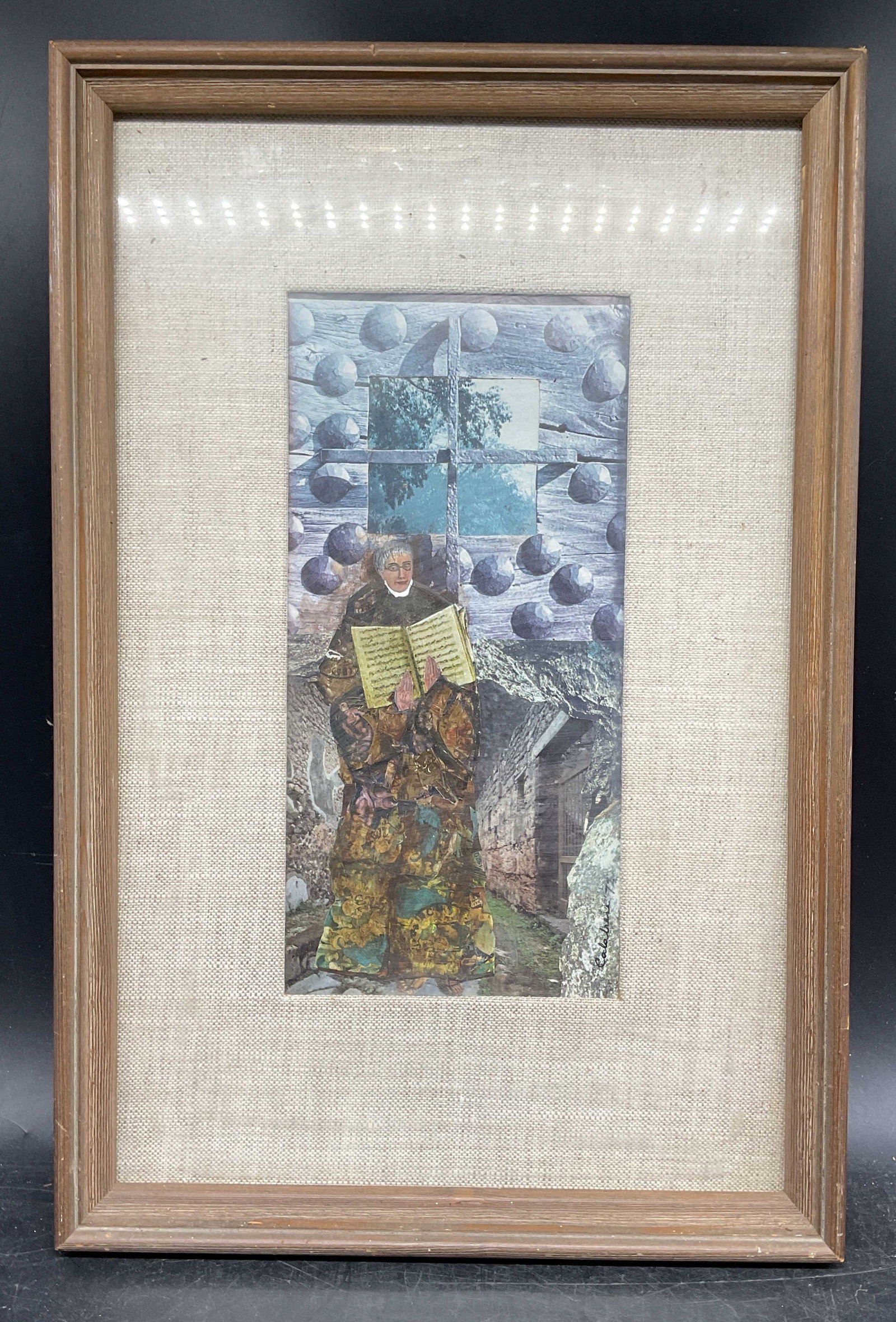 1972 Framed Signed Woman & Book Collage: Framed and matted paper cut out collage. Signed and dated lower right, illegible, possibly Colobere, 1972. Woman holding a book. Inscribed on reverse Forza Del Destivo Verdi. Italian postage stamp on 