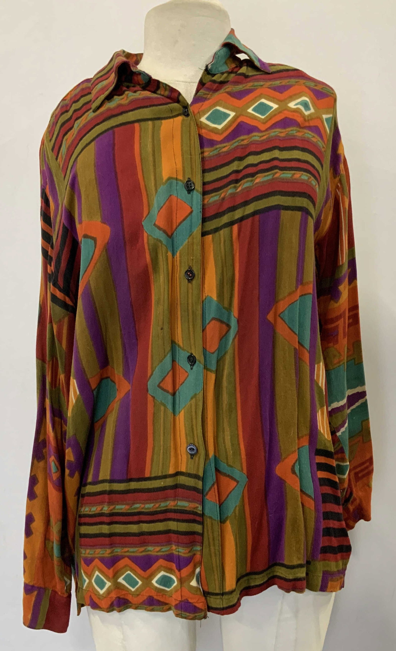 Something Different Rayon Long Sleeve Shirt INDIA: Size Small. 100% rayon. Long sleeve shirt features a vibrant, geometric southwestern style. Purple, pink, orange, black, olive. Signed & marked. Reads, SOMETHING DIFFERENT. Made in India. Surface wear