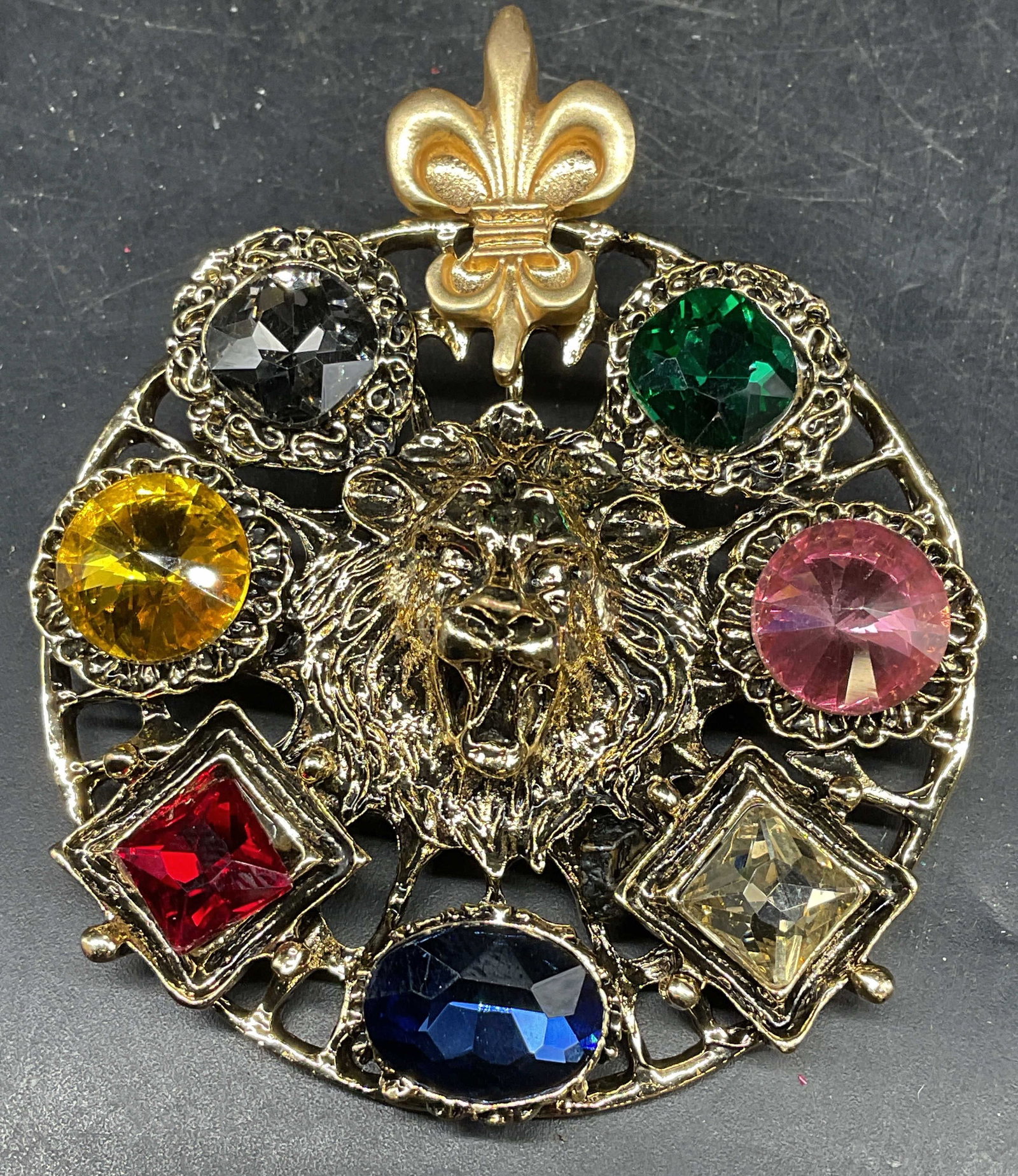 Vintage Gold Tone Crystal Lion Brooch: Vintage gold tone lion head brooch with multicolor lucite crystals. Measures approx. 2.75 x 2.25 inches. Some scratching. Jewelry, estate jewelry, costume jewelry, cocktail jewelry, fashion jewelry, a