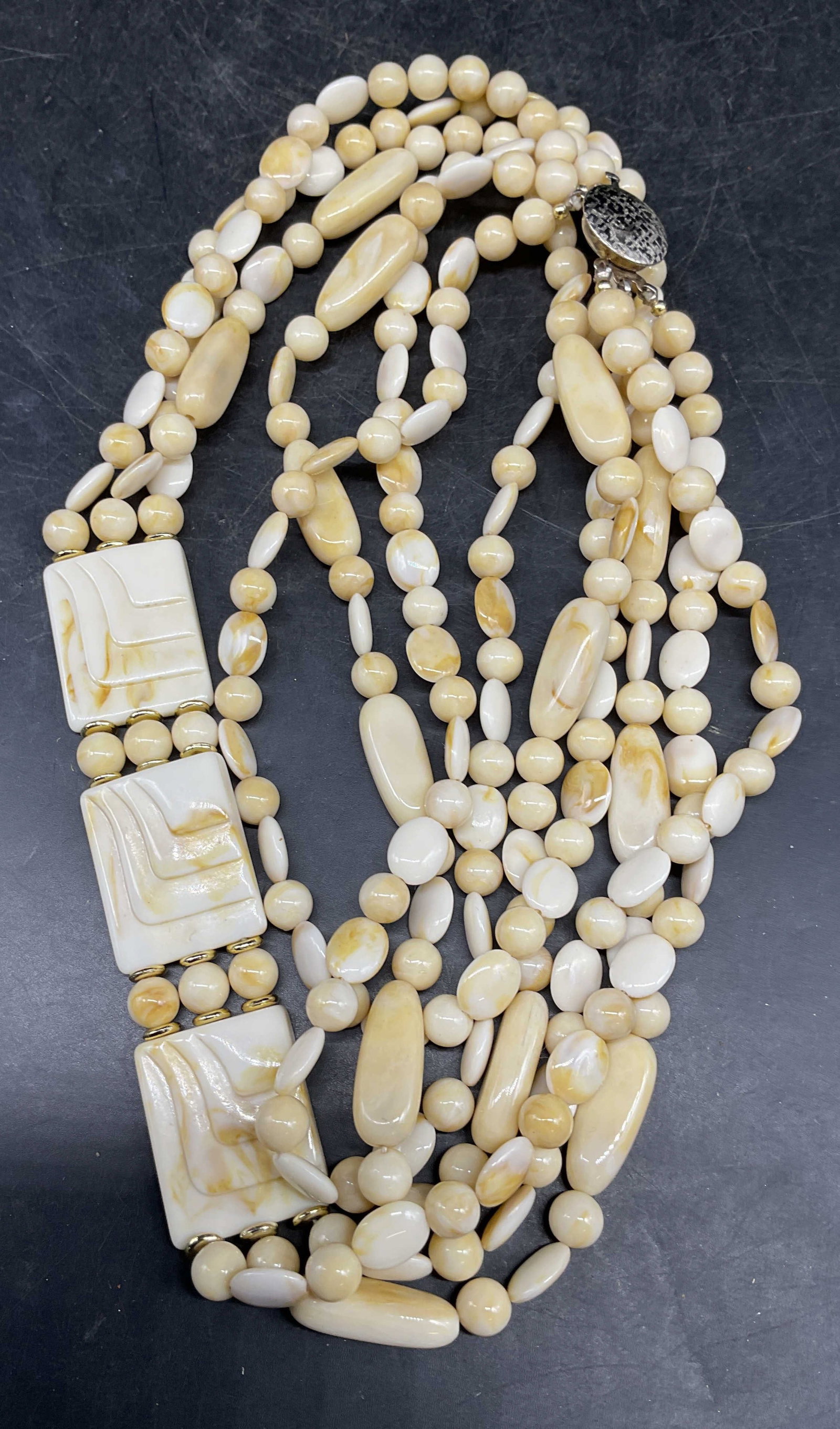 Vintage 3 Strand Faux Bone Necklace: Vintage 3 strand faux bone beaded necklace with gold tone accents. Drop length measures approx. 16 inches. Some scratching. Jewelry, estate jewelry, costume jewelry, cocktail jewelry, fashion jewelry,