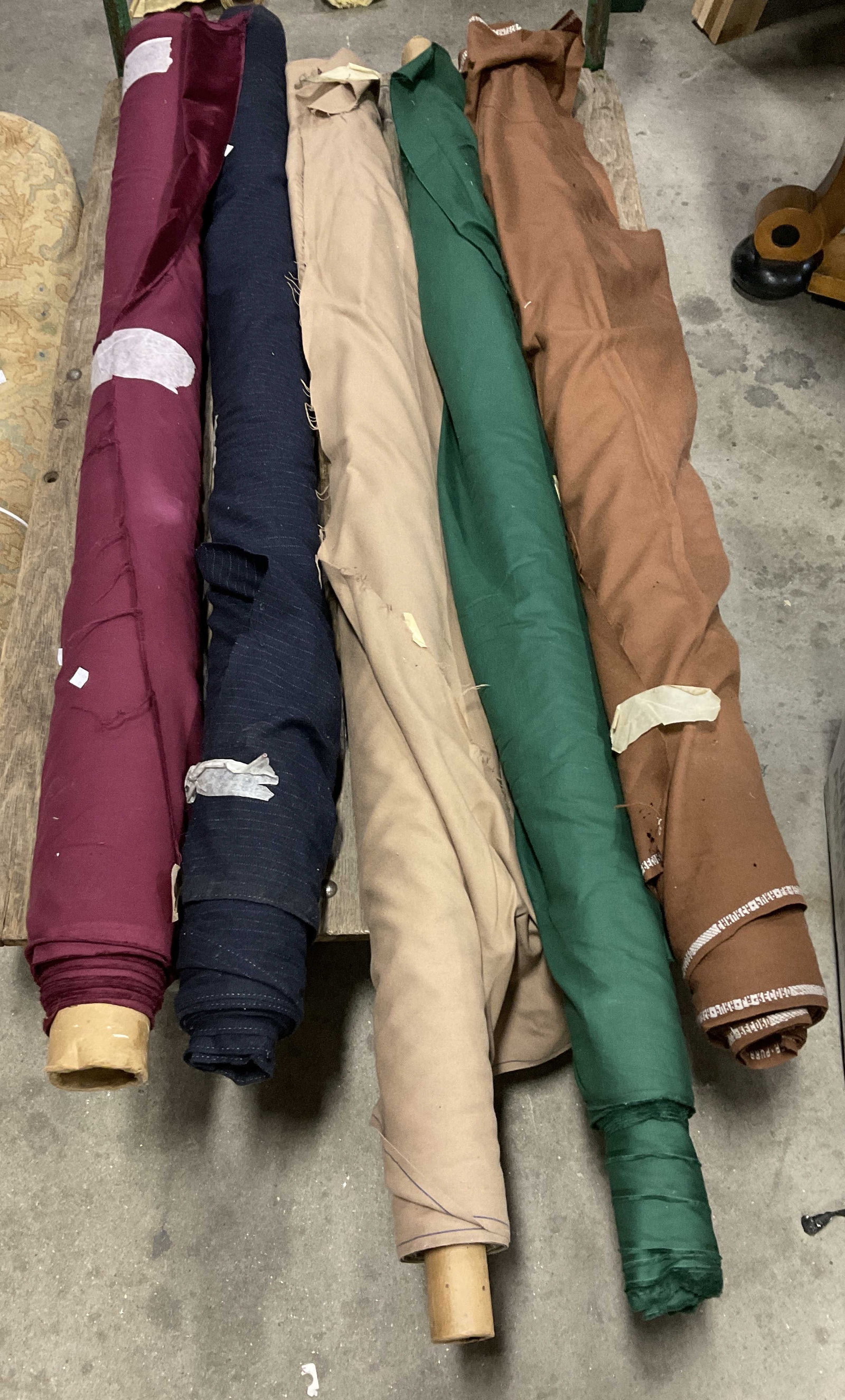 Lt 5 Solid and Pinstriped Bolts of Fabric: Lt 5 Solid and Pinstriped Bolts of Fabric. Mixed Materials. Wool, Velvet, Cotton, and More. Solid and Pinstriped Patterns. Brown, Navy Blue, Maroon, and Green. Not Measured, Unrolled, or Inspected. So