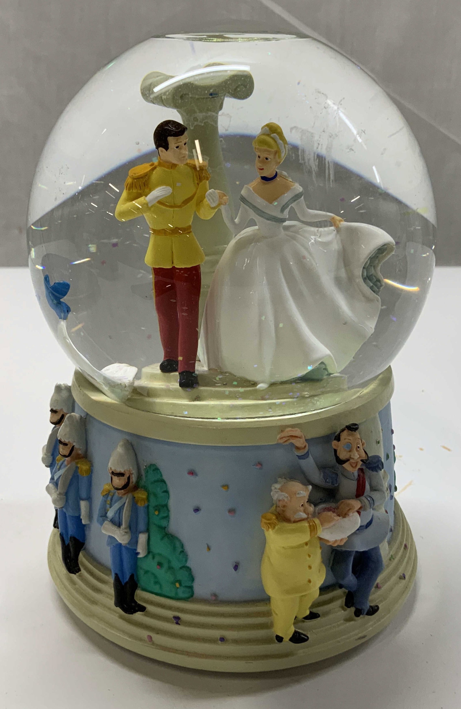 Disney Cinderella & Charming Musical Snow Globe: Disney Cinderella & Prince Charming musical snow globe. Plays, A Dream Is a Wish Your Heart Makes. Resin material. Signed & marked. Reads, DISNEY A DREAM IS A WISH YOUR HEART MAKES WORDS & MUSIC BY MA
