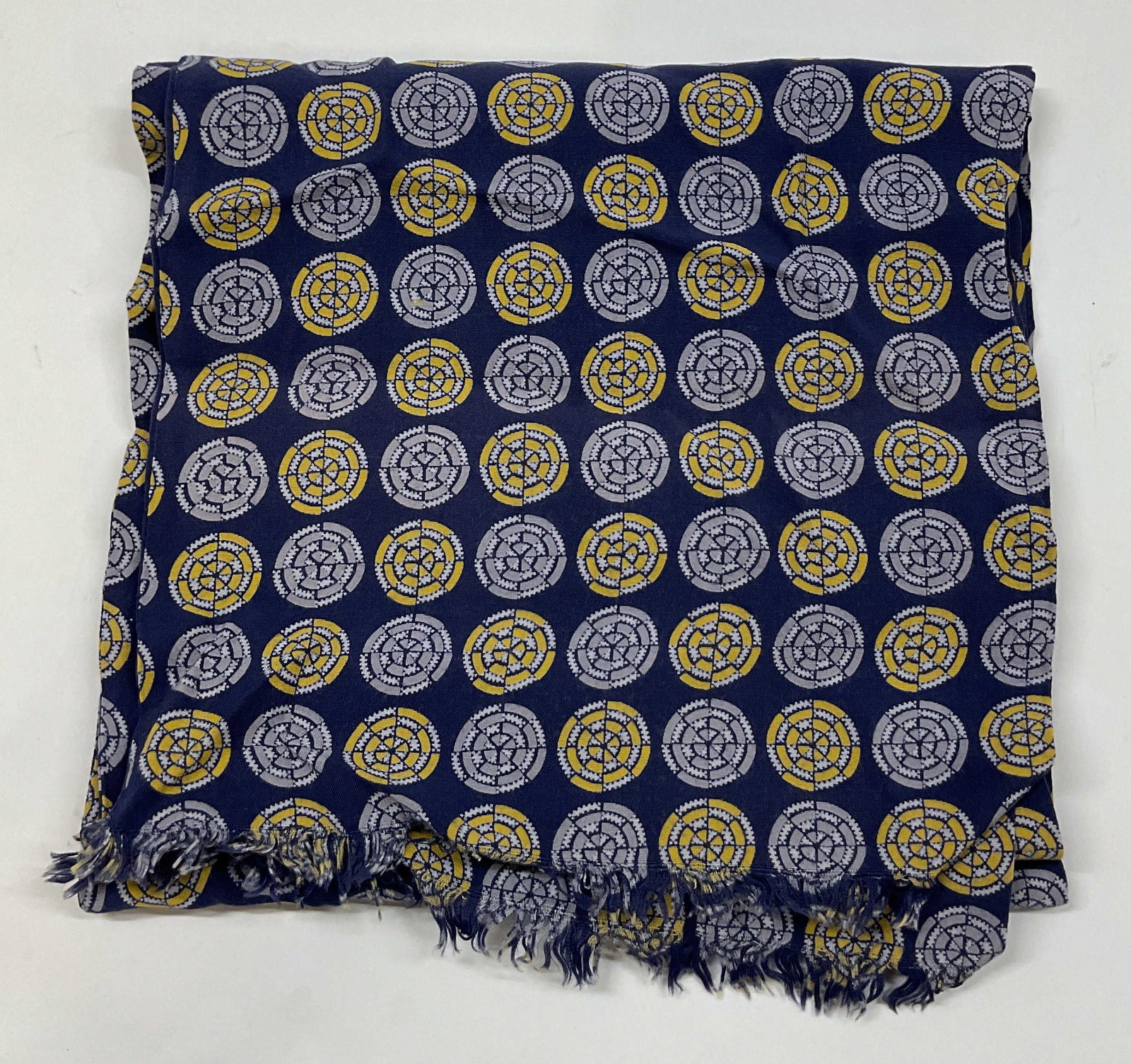 Vintage Blue Geometric Fringed Scarf: Vintage blue geometric fringed scarf. Cotton material. Blue fringed trim. Geometric pattern in blue, grey, and yellow. Measures approx 11 x 40 inches. Wear consistent with exposure. Scarf, wearables, 