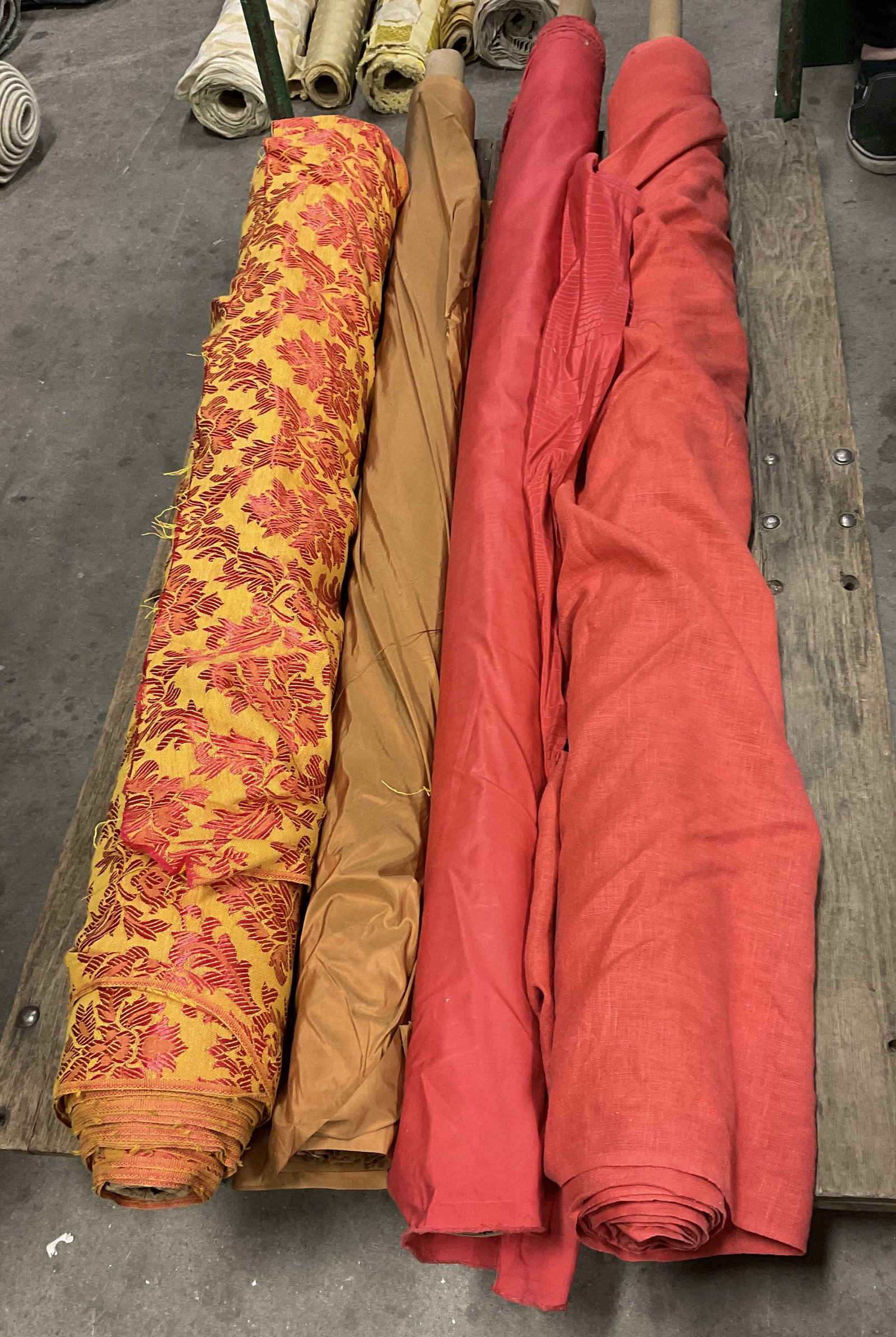 Lt 4 Solid and Floral Bolts of Fabric: Lt 4 Solid and Floral Bolts of Fabric. Mixed Materials. Linen, Silk and More. Solid Red, Brown and Yellow Floral Pattern. Not Measured, Unrolled, or Inspected. Sold As Is. Part of Large Collection of 