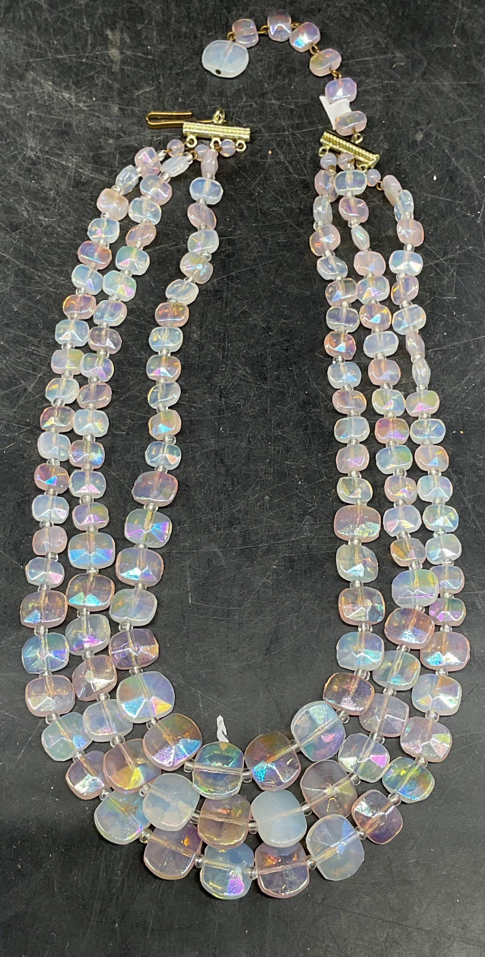 Iridescent Pink Crystal Necklace, West Germany: Vintage iridescent pink and white beaded three strand crystal necklace. Made in West Germany. Drop length measures approx. 7 inches. Some scratching. Jewelry, estate jewelry, costume jewelry, cocktail