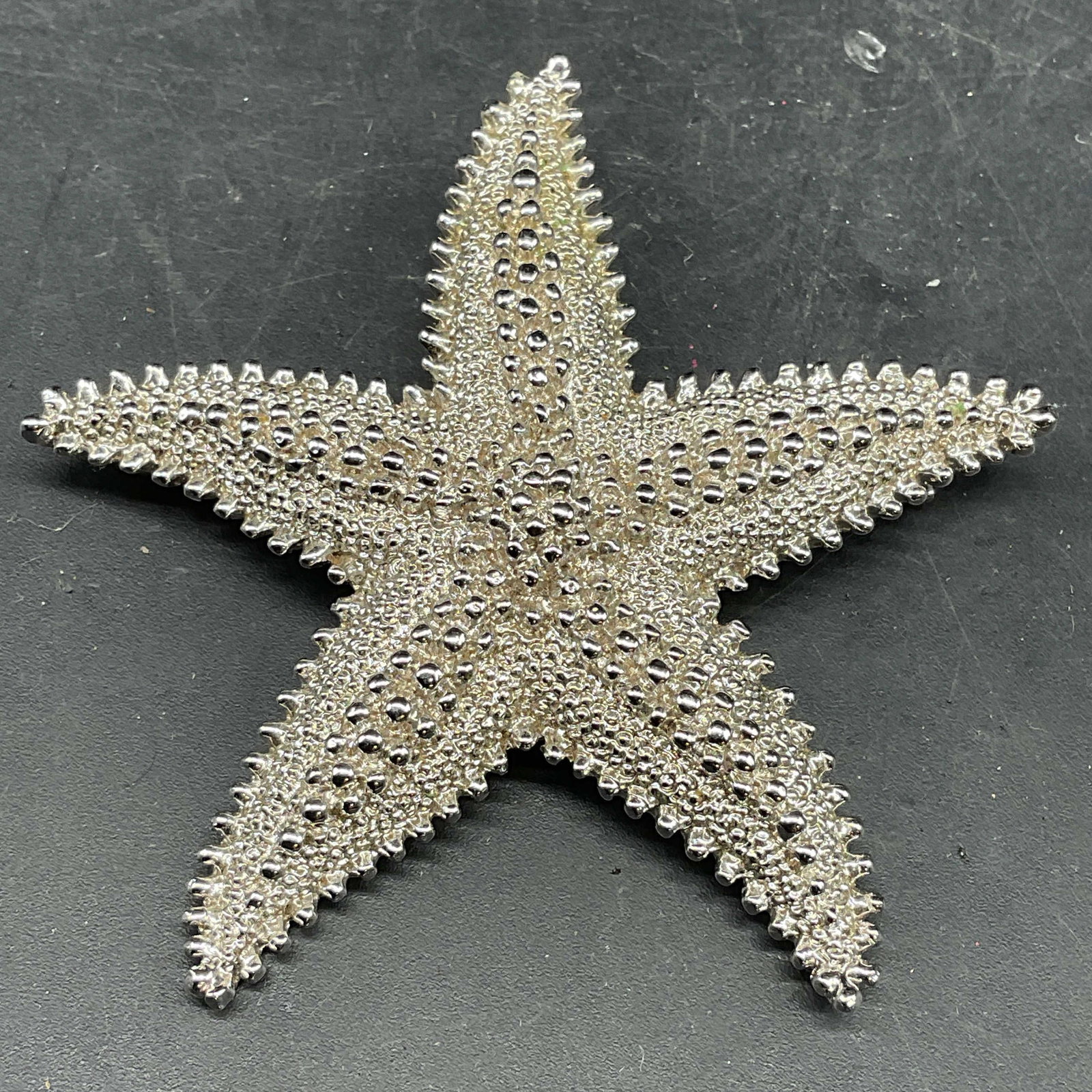 Vintage Monet Silver Tone Starfish Brooch: Vintage signed Monet silver tone textured starfish motif brooch. Measures approx. 2.5 x 2.75 inches. Some scratching. Jewelry, estate jewelry, costume jewelry, cocktail jewelry, fashion jewelry, acces