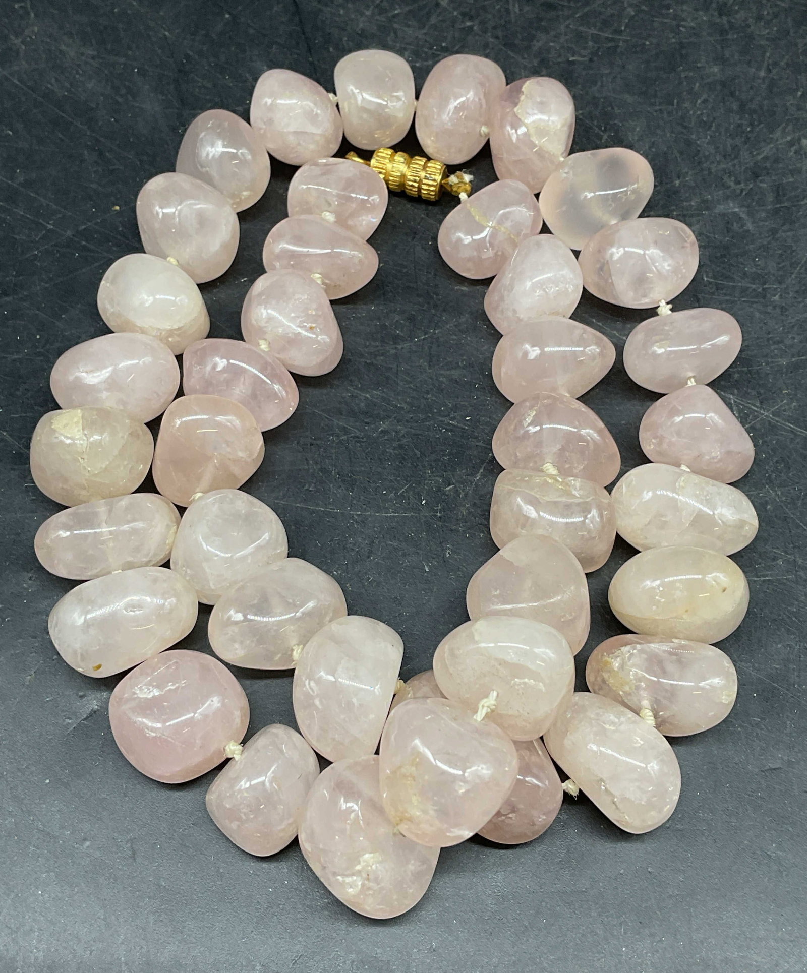 Vintage Pink Semiprecious Beaded Necklace: Vintage pink semiprecious stone beaded necklace. Possibly jade. Drop length measures approx. 10 inches. Total weight 150.4 grams. Some scratching. Jewelry, estate jewelry, fine jewelry, cocktail jewel
