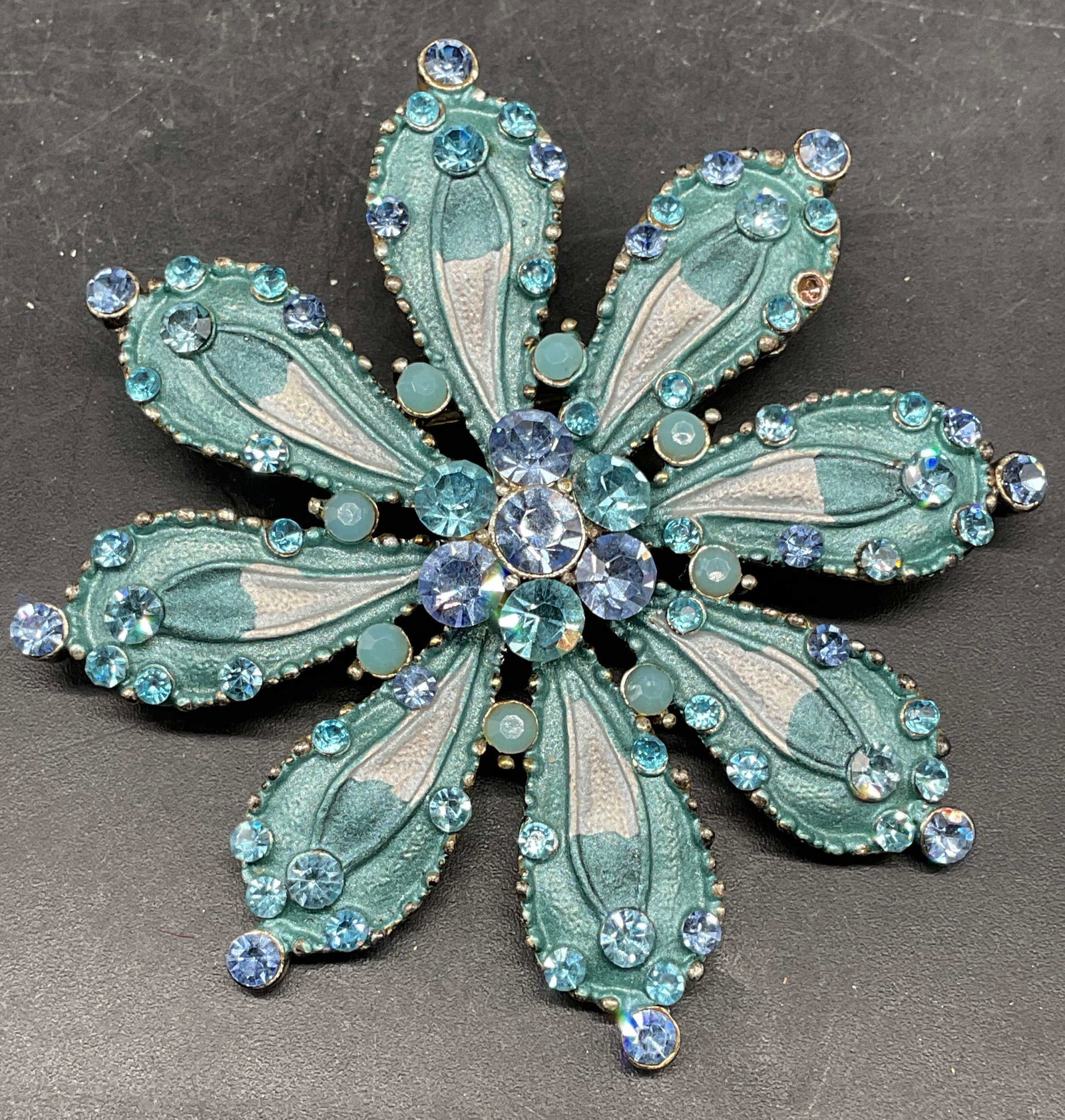Vintage Silver Tone Blue Crystal Flower Brooch: Vintage silver tone blue flower brooch with crystal decoration. Measures approx. 2.5 inches wide. Some crystals need replacement. Some scratching. Jewelry, estate jewelry, costume jewelry, cocktail je