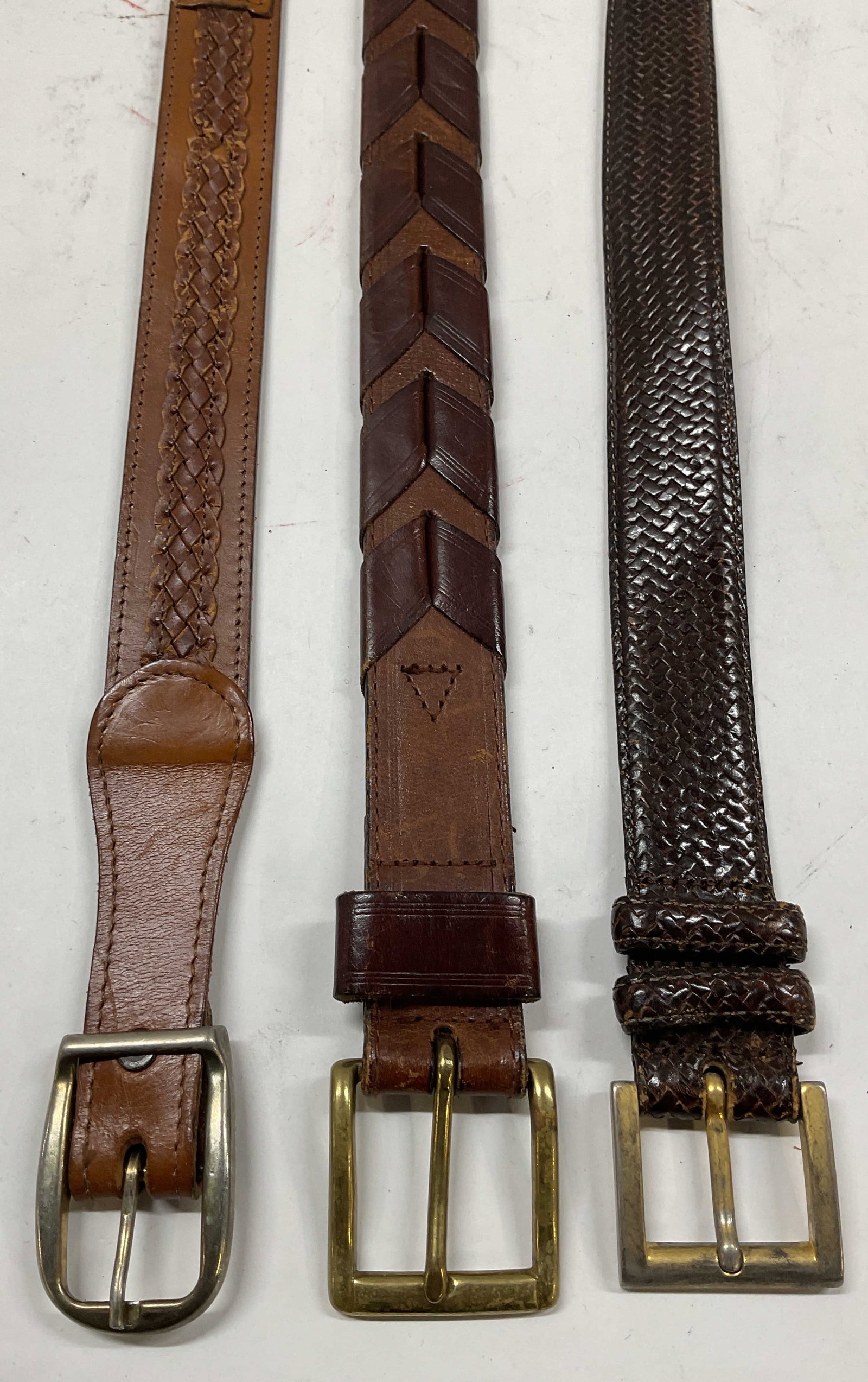 Lot 3 Woven Brown Leather Belts USA: Lot of 3 woven brown leather belts. Largest measures approx. 37.5 inches. One made in USA. some wear to hardware and leather including scratching and rubbing. Belt, leather belt, accessories, fashion