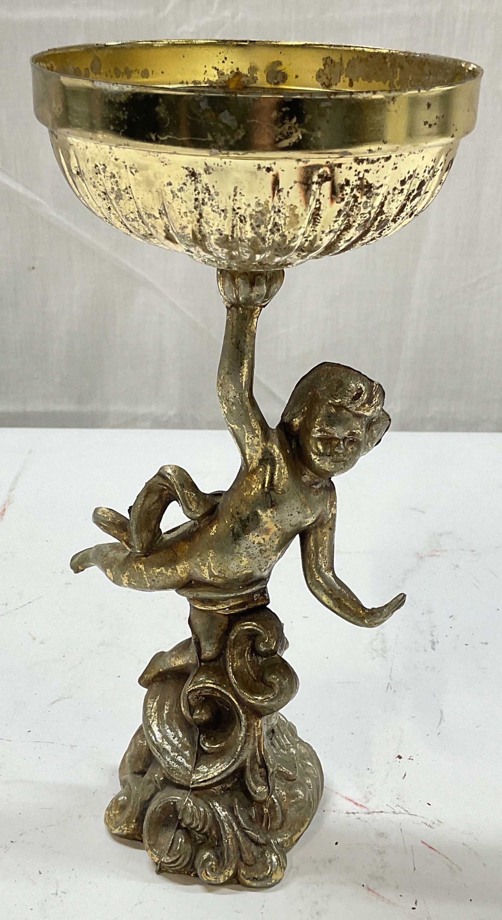 Vintage Gilt Victorian Style Cupid Compote: Vintage gilt metal Victorian revival style Cupid motif compote bowl. Measures approx. 4.75 x 4.25 x 9 inches. Wear including scratching and loss to gilt. Cupid compote, Cupid bowl, cherub bowl,