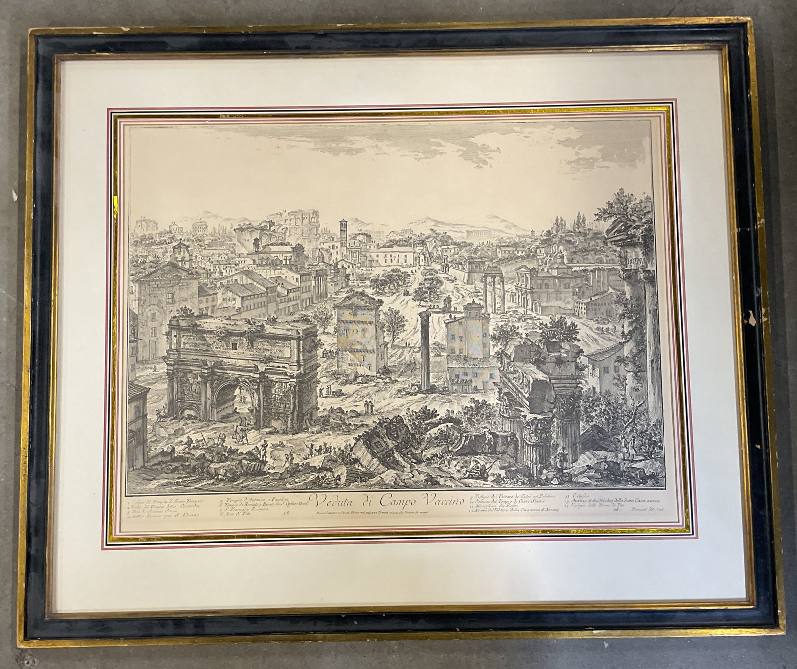 Framed After Piranesi Campo Vaccino Print: Framed and matted fine art reproduction print. After Piranesi, View of the Campo Vaccino. Gilt wood frame. Not examined out of frame. Frame measures approx. 25 x 30 inches. Wear including foxing. Prin