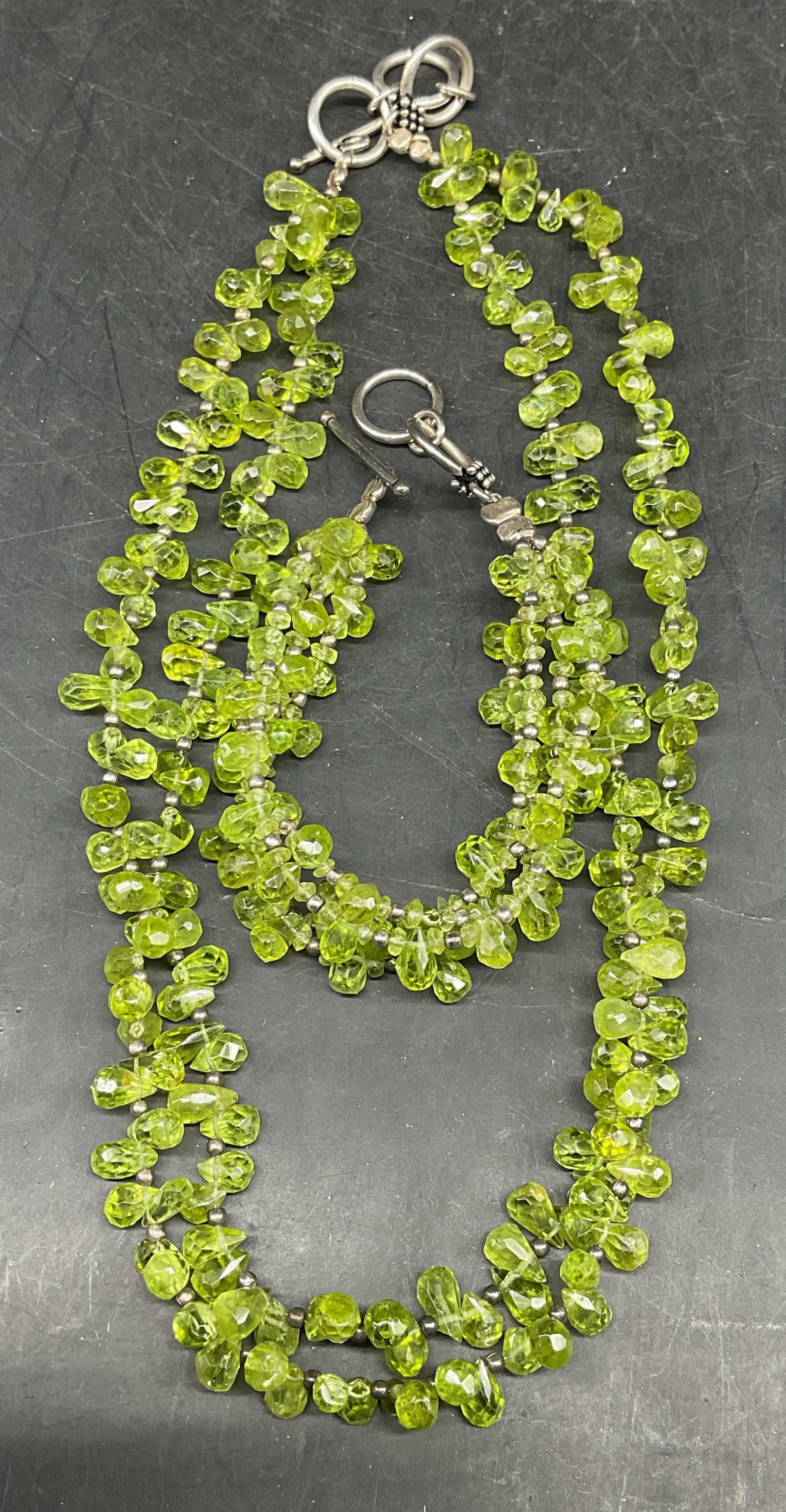 Lot 2 Semiprecious Sterling Silver Necklace +: Lot of 2 matching jewelry pieces. Green semiprecious tone beaded necklace and bracelet with sterling silver beads and clasps. Necklace drop length measures approx. 8 inches. Bracelet measures approx. 