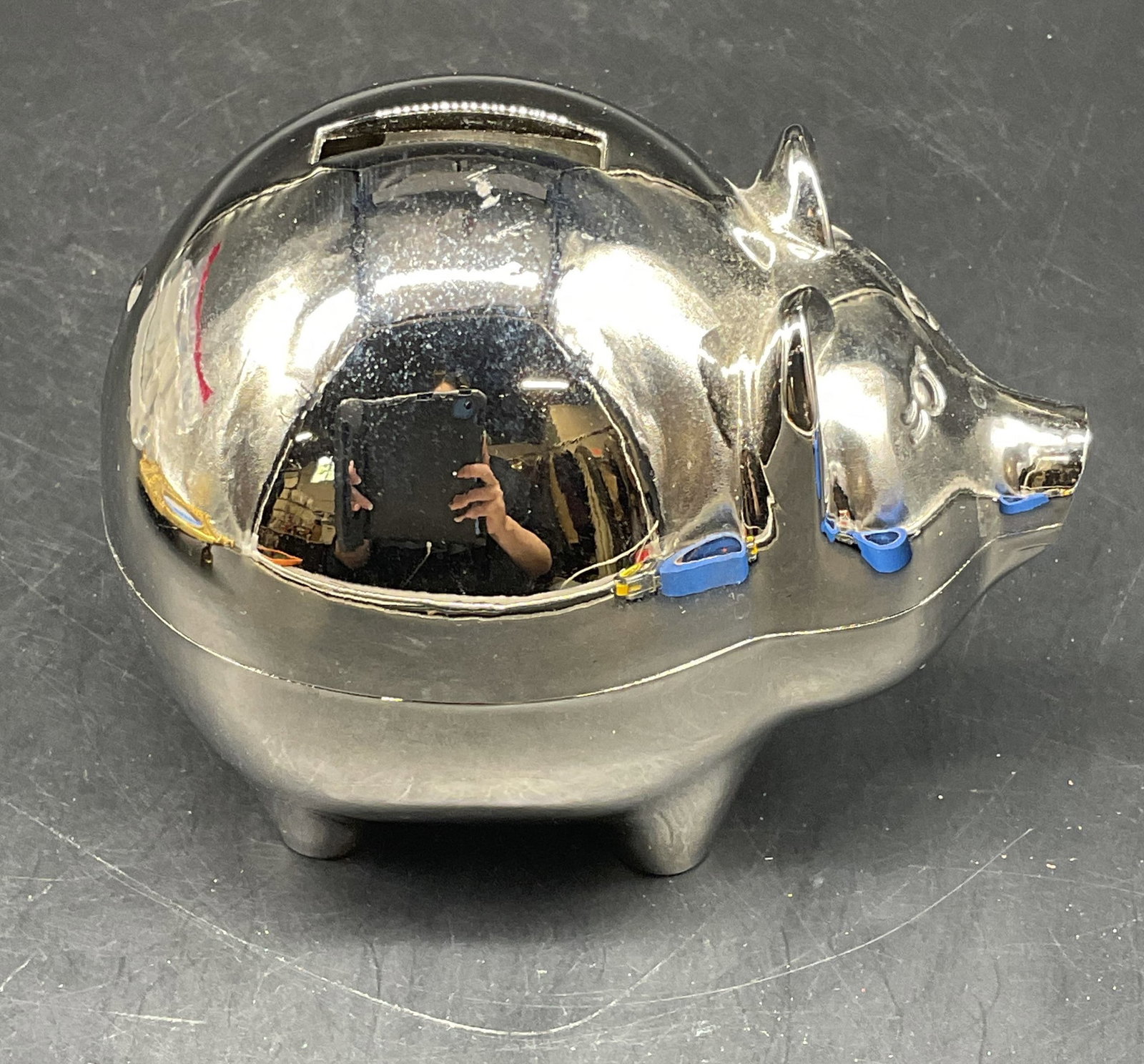 Silver Tone Metal Piggy Coin Bank: Silver tone metal piggy bank, coin bank. Measures approx. 5 x 3.5 x 4 inches. Top not securely attached. Piggy bank, pig bank, coin bank, metal bank, home decor, home accessories, table decor, table a
