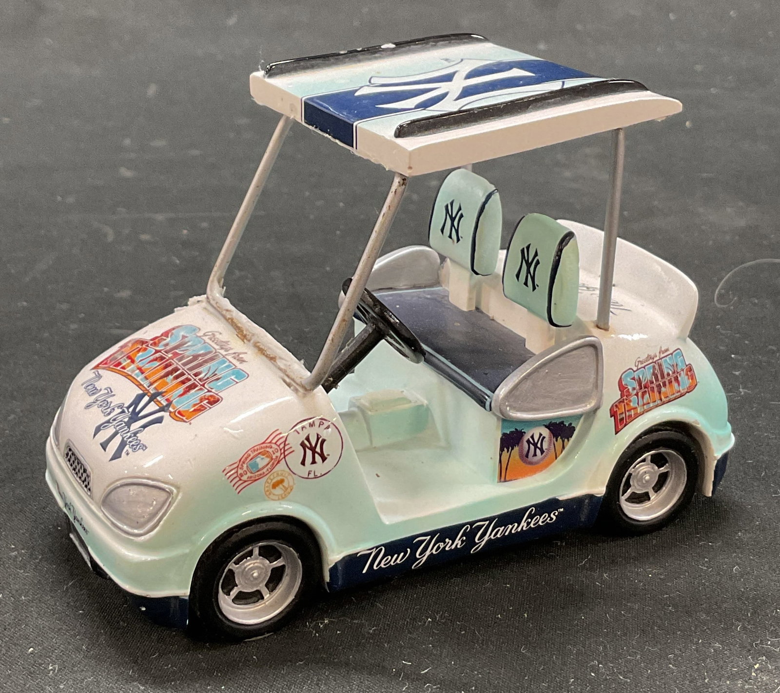 2010 Hamilton Collection NY Yankees Golf Cart Fig: Hamilton Collection MLB New York Yankees golf cart figure. Marked on underside as photographed here. Titled Spring Training from the New York Yankees Golf Cart Collection. Dated 2010. Ceramic and hand