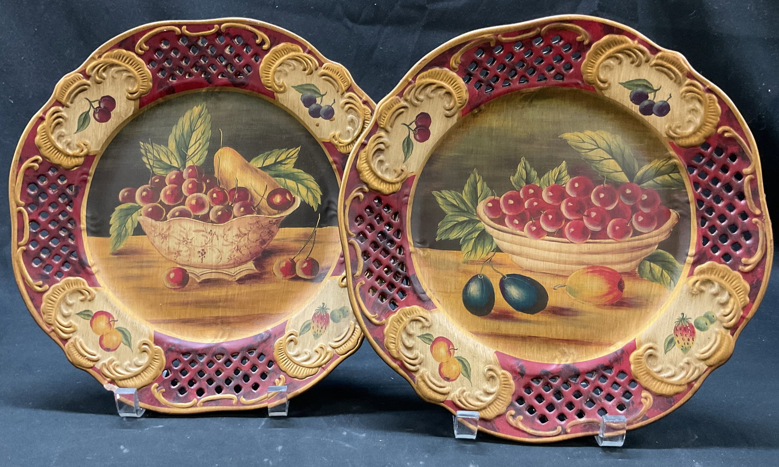 Set 2 Vintage Ceramic Painted Fruit Deco Plates: Lot of 2 vintage ceramic hand painted fruit decorative plates. Round plates with scalloped accents. Hand painted fruit motifs in varying colors. Cut out diamond like pattern accent. Embossed surface w